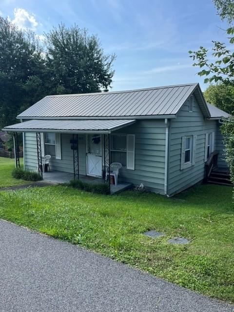 Charming, affordable, and full of character, this adorable 2-bedroom, 1-bath cottage is perfectly situated on a desirable corner lot just minutes from the renowned Virginia Creeper Trail and the heart of Historic Abingdon, Virginia. Whether you're looking for a first home, investment property, or a cozy place to enjoy small-town living, this home offers exceptional value in a prime location. Inside, you'll find a comfortable and functional floor plan featuring a welcoming living room, separate dining room, kitchen, laundry area, and two spacious bedrooms. A partial basement provides excellent additional storage, while the durable metal roof—replaced just a few years ago—offers added peace of mind. Enjoy the convenience of being just minutes from everything Abingdon has to offer, including locally owned restaurants, grocery stores, shopping, medical facilities, parks, and the famous Virginia Creeper Trail. Bring your offers and your vision to  bring this sweet home back to life!