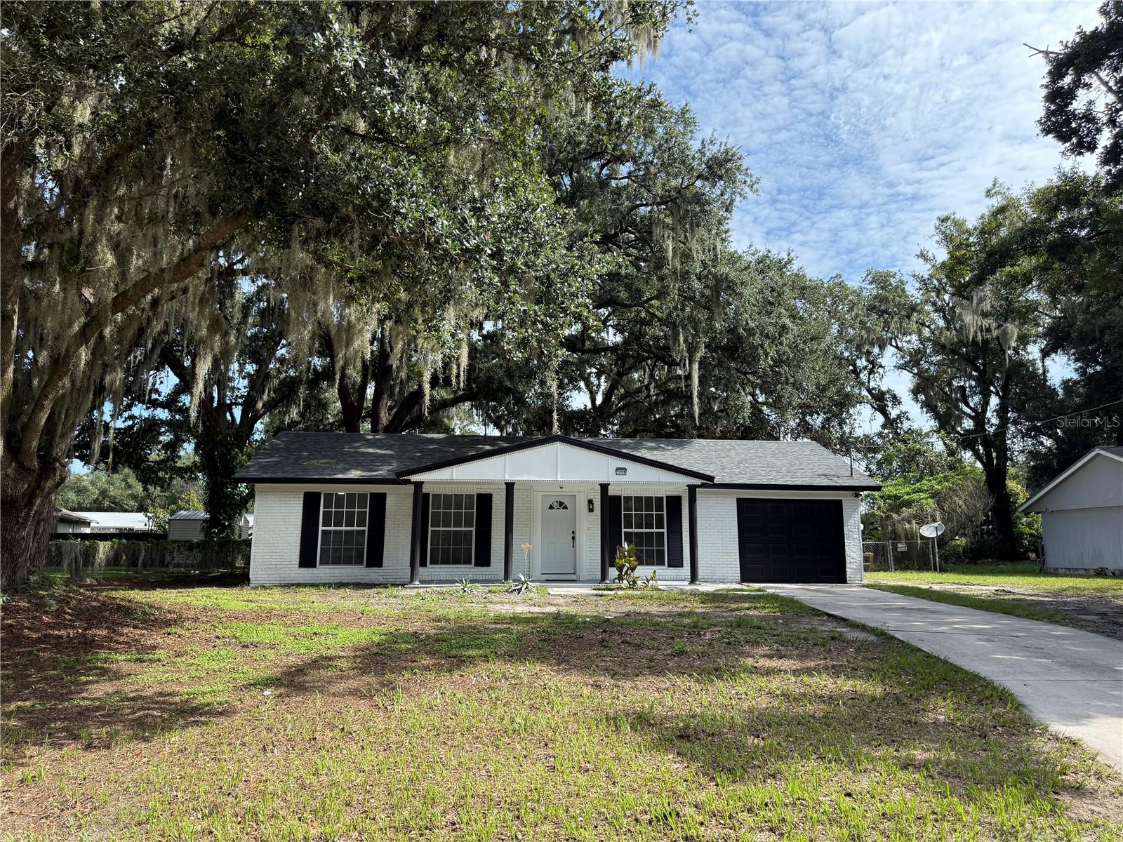 **Exceptional opportunity to own this beautiful property featuring a spacious lot with NO HOA, NO CDD, no deed restrictions, and located in Flood Zone X. Enjoy the freedom and flexibility this home offers while staying conveniently close to shopping, dining, entertainment, and everyday amenities. This well-maintained 3-bedroom, 2-bath home features a fresh modern color palette ,a roof replaced in 2022, and new A/C . bright a living and dining areas, and durable laminate flooring throughout. The updated kitchen offers stylish cabinetry, granite countertops,  and a window that brings in an abundance of natural light. The fully fenced backyard provides privacy and functionality, featuring a gated area with additional space for a workshop, storage, and outdoor projects. With a spacious  car garage and plenty of room for your RV, boat, trailer, or recreational vehicles, this property is perfect for those who value space and flexibility.  your hobbies and enjoy everything this home and its location have to  Schedule your private showing today!**