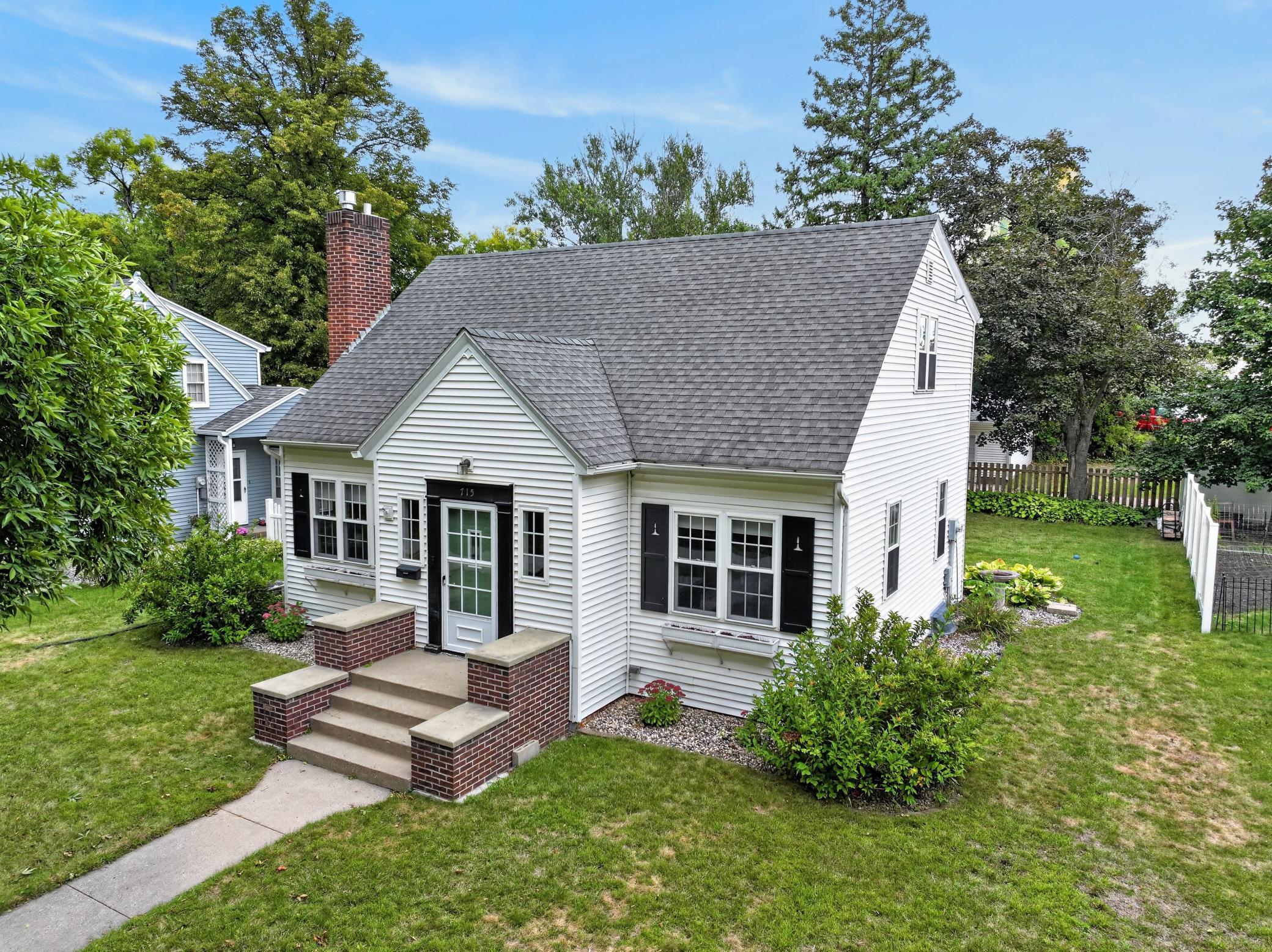 Charm, character and a few unexpected surprises await in this 1936 home! Bathed in natural light and filled with the craftsmanship that makes homes of this era so special, you’ll find original oak hardwood floors, rounded archways, ceiling coving, built-in corner hutches in the dining room and a homey living room fireplace that creates an inviting focal point. But some of the best surprises are upstairs. Of the home’s 3 bedrooms and 2 full baths, two bedrooms are on the upper level, including the primary bedroom with something you might not expect in a home of this era—a walk-in closet and direct access to the full bath, which also serves the second bedroom. Built-ins and additional closets provide an impressive amount of upstairs storage. Back on the main floor, another bedroom, full bath, plus a separate den or office offers flexible space for working from home, hobbies or whatever fits your lifestyle.While the character may be timeless, many of the home’s essentials are anything but old. Vinyl siding and vinyl windows throughout offer ease of maintenance, while the washer, dryer, water softener, range and refrigerator are all six years old or newer. The furnace and central air were replaced in 2023.Looking for even more space? The lower level offers an opportunity to expand the home’s finished living area and potentially create a larger bathroom if desired. The roughed-in bathroom includes an existing toilet that is not currently in service.Step outside to a fenced, private backyard surrounded by mature landscaping, including colorful hydrangeas, hostas and stately trees—including a beautiful maple. A concrete patio offers a great spot for bonfires, relaxing evenings and outdoor entertaining.The detached double garage is conveniently located just across the alley.There’s something special about Maple Street, where mature trees stretch overhead to create an umbrella-like canopy and vintage streetlights add to the neighborhood’s charm. This highly desirable, walkable neighborhood puts Noonan’s Park and playground just a short stroll away, where ducks and geese add to the scenery during the warmer months and the skating rink brings winter fun when the seasons change.