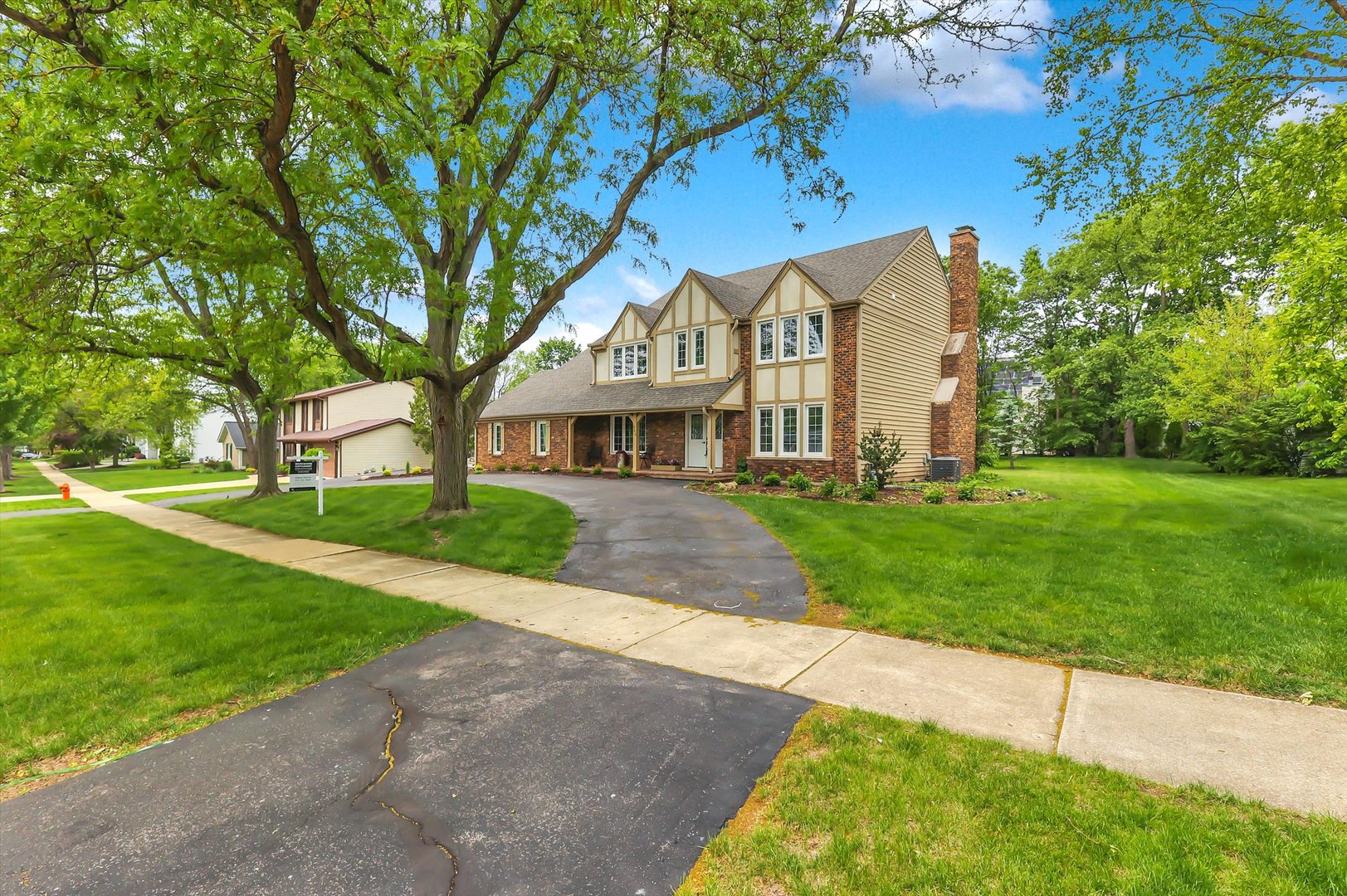 Timeless design, unmatched character, and complete TURN-KEY renovation designed perfectly for today's lifestyles. In-Law arrangement located on the main level, 5th bedroom with private entry, closet, vaulted ceiling or OFFICE. A Chef's kitchen featuring custom white Shaker cabinetry, quartz counter tops, farm sink, high-end stainless steel appliances, bank of pantry cabinets with coffee bar and breakfast area overlooking the rear yard. New Features: Front entrance door, new Landscaping, 5" White Oak hardwood flooring, carpet, light fixtures, plumbing fixtures, paint, large 5" base, casing, trim, doors, wrought iron spindles, bathrooms & showers. Dining room features a climate controlled wine closet with glass door. Family room oversized fireplace, wet bar, and coffered ceiling. Large mud room with drop zone. (2nd floor laundry) Primary suite with expansive bath featuring free standing soaking tub, oversized shower with dual head shower system, and BCAN smart toilet with advance bidet, Primary suite offers large custom closet with island dresser and lighting. Finished basement with half bath. Furnace, sump pump, windows, patio doors, electric newer in 2025.  Covered front porch and rear deck for your summer enjoyment. Close to Downtown Naperville.
