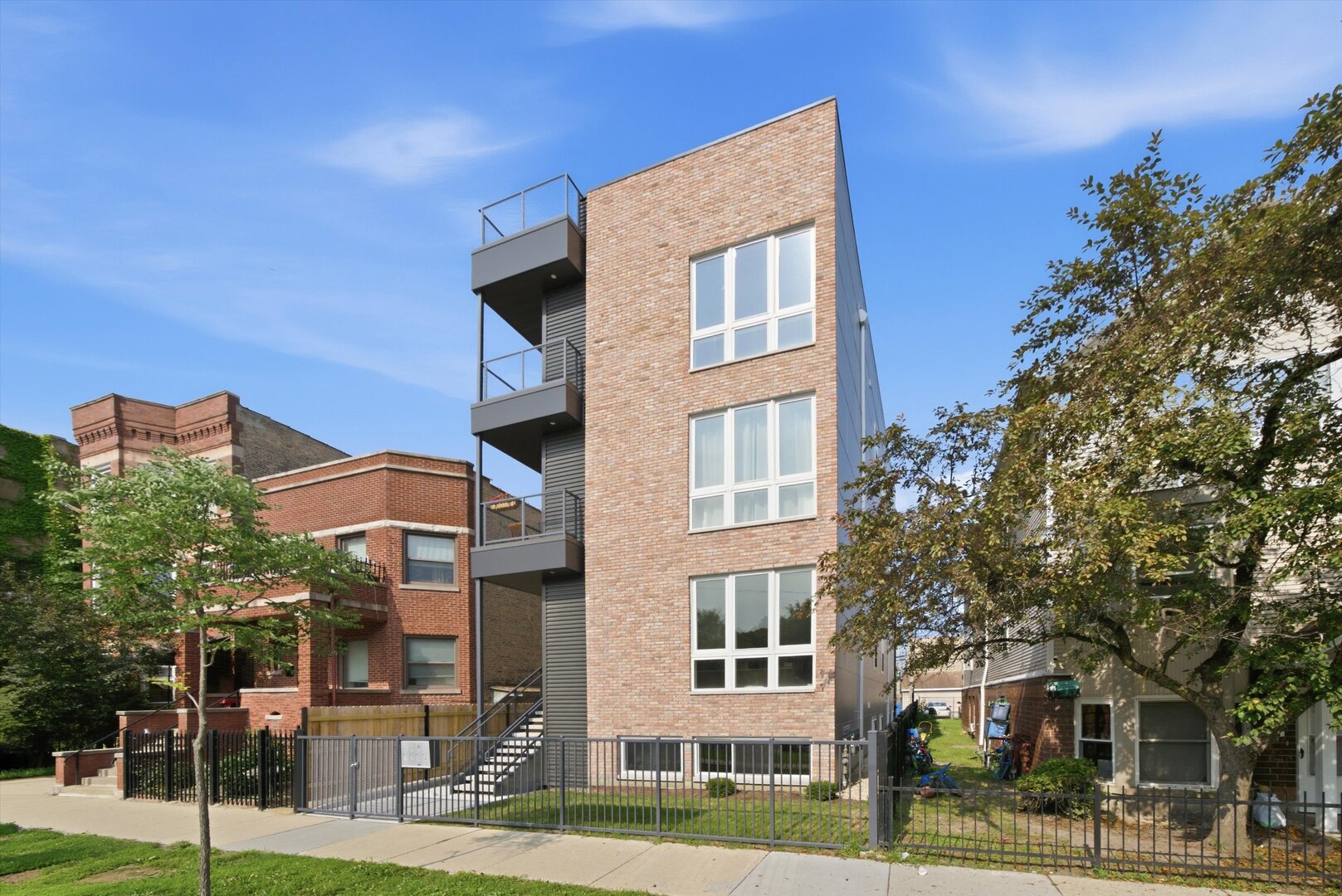 READY FOR OCCUPANCY. ONLY 2 UNITS LEFT. Welcome to one of the most unique residences in Chicago-an extra-wide lot, brand-new construction condo offering the perfect blend of modern elegance and timeless scenery. Exclusive roof rights for the entire 1,500 SF rooftop, offering rare private outdoor space with unobstructed Chicago skyline views. A tandem parking space (2 spots). This incredible home offers 3 spacious bedrooms and 2 beautifully designed baths. From the moment you step inside, you're greeted with panoramic, uninterrupted views of lush park greenery framed by the Chicago skyline-a setting so serene, it feels like you're in Central Park, New York. The sun-drenched living room with floor-to-ceiling windows opens directly to a front balcony overlooking the park, the perfect spot to enjoy the incredible scenery to the fullest. The two-tone designer kitchen is a showstopper, featuring an oversized peninsula, sleek cabinetry, and premium finishes-perfect for both entertaining and everyday living. Throughout the unit, hardwood floors and elegant design touches elevate the sense of luxury. The primary suite is a private retreat, complete with a massive walk-in closet and a spa-inspired bathroom with stunning tilework, a double vanity, and a walk-in shower. Two additional bedrooms, larger than typical for Chicago living, share a second thoughtfully designed bath. Enjoy the outdoors with multiple spaces: a private front balcony with park views and a rear balcony. This unit has roof rights for an entire deck with east-facing views. Check out the most unique roof rights in the area, offering one of the most breathtaking, unobstructed views of the Chicago skyline. In-Unit washer and dryer. This home is more than a condo-it's a lifestyle located across the street from the park. With its one-of-a-kind views, sophisticated design, and prime location, it's a rare opportunity to own something truly extraordinary in the heart of Chicago. *** Special financing available for qualified buyers. $7,500 closing cost credits, below market rates and no PMI with as little as 3% down through Citi Bank. Call for more information.