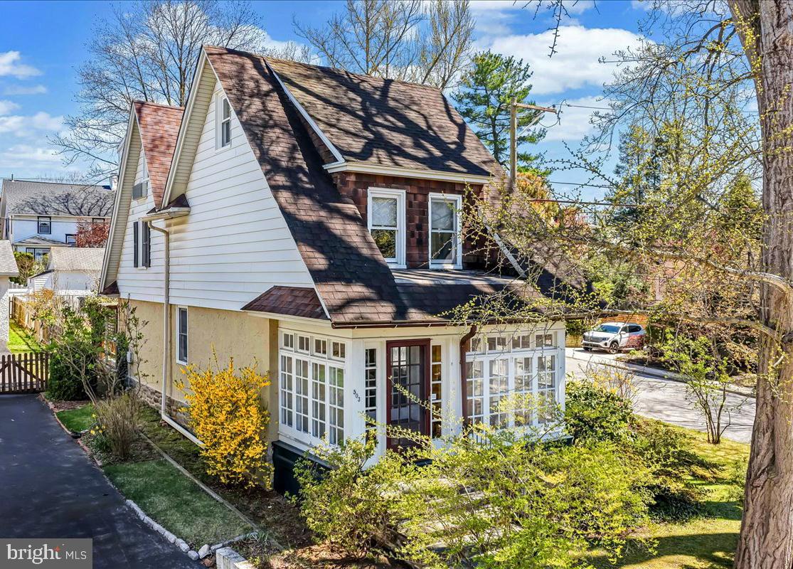 Welcome to 503 Dudley Avenue in delightful Narberth. This classic home was built in 1900 and has been updated recently by the current owners. The kitchen was expanded and updated in 2015. The wall between the dining room and kitchen was removed creating a light filled open space that became the heart of this home. The island is a focal point of the kitchen for eating and work space. There are soapstone counter tops, ceramic tile back splashes, stainless appliances, lots of classic white cabinetry and a radiant heated floor (perfect for warming you up during a winter breakfast). The front entry opens to a charming enclosed porch filled with windows and a pretty oak floor.  Glass paneled French doors lead you into the roomy and comfortable living room offering a builtin bookcase and oak floors with mahogany trim. Another set of glass paneled French doors lead you to the open flow of the dining room/kitchen Great room. Chair rails and hardwood floors enhance the vintage feel of the dining room. The kitchen door accesses the rear yard deck that's made for al fresco dining, impromptu celebrations and quiet private moments. The 2nd floor contains the main bedroom and two family sized bedroom and the updated hall bath with stylish ceramic tile and glass highlights. The 3rd floor is a special private space. The three room suite has the 2nd updated full bath, a work from home space and the 4th bedroom. This space can be easily transformed into a main bedroom suite. And don't miss the attic storage closet. The basement is another good storage area. The included clothes washer and freezer are in the mechanicals room of the basement. If you have spent any time in Narberth you understand why it is a designated Tree City, USA - especially now when everything is blooming. Narberth's excellent walk-ability rating, restaurants, playgrounds, movie theater and shopping options help make it a very popular community.