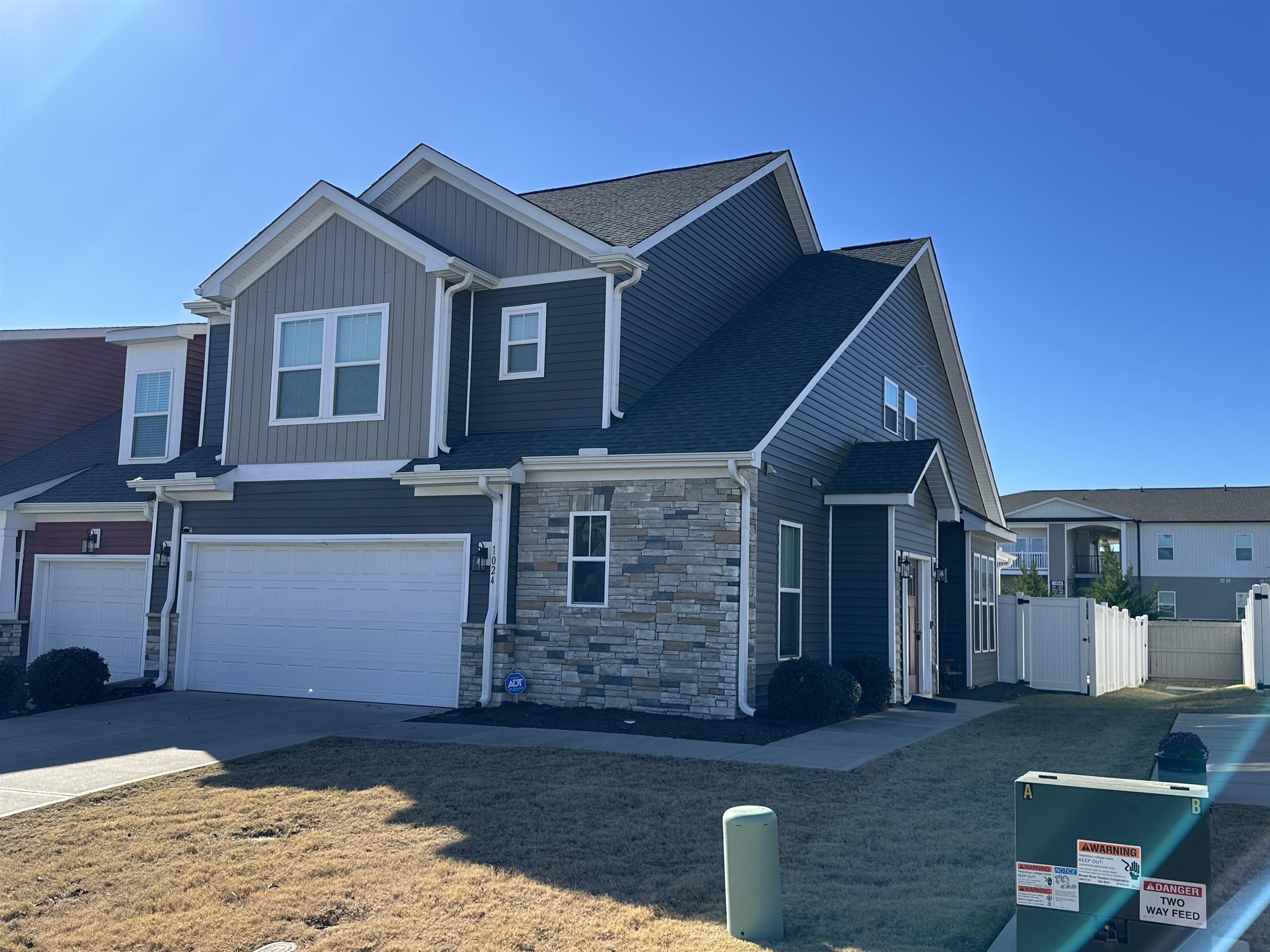 Centrally located in Boiling Springs less than a mile from Publix, Ingles, and a growing selection of new restaurants, this upgraded corner-unit townhome stands out from the rest. Tons of upgrades inside and out! Custom pull-out kitchen shelving, brand-new paint throughout, brand new top-of-the-line carpet, luxury vinyl planking. The spacious primary suite offers judge’s panel trim and a tiled shower, while two laundry areas—one downstairs and a walk-in upstairs—add everyday convenience. Enjoy large bedrooms, an open loft ideal for entertaining. Brand new  built-in shelves in upstairs storage closet. Screened porch with fenced yard. 2-car garage. Lawn maintenance is included for low-maintenance living! Must See!