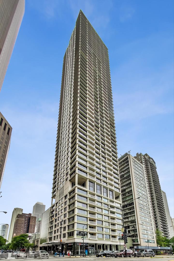 Stunning Lake & City Views from this Corner Gold Coast Condo!  This rarely available tier offers breathtaking panoramic views and an unbeatable location at Oak St and Lake Shore Dr. Completely updated with top-of-the-line finishes, this residence features a Sub-Zero refrigerator, Wolf cooktop and double oven, Bosch washer and dryer, and a built-in surround sound system throughout. The thoughtfully designed floor plan includes a den open to the living room, which can be converted to a 3rd bedroom. The primary suite boasts a spa-inspired bath with a soaking tub, glass-enclosed shower, separate water closet as well as a large walk-in closet. An additional walk-in closet in the hallway offers exceptional storage. Step onto the east-facing terrace from the living room to enjoy serene lake views. Expansive picture windows flood the home with natural light, and spacious rooms provide a sense of elegance and comfort.    The building offers 24-hour door staff, an indoor pool, a west-facing sundeck, a party room, a state-of-the-art fitness center, garage parking, and guest parking.