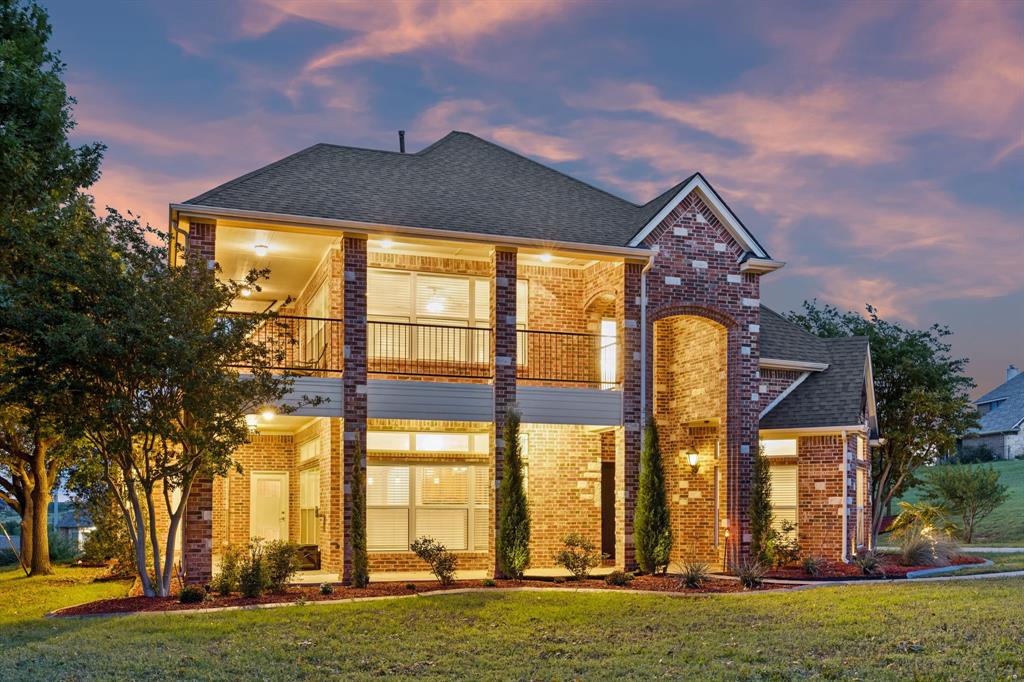 Buyers searching for homes in Fort Worth with acreage and lakeside proximity will find an exceptional opportunity at 3721 S Lighthouse Hill Ln. Perched on an elevated, large 1-acre lot within the gated Harbour View Estates community near Eagle Mountain Lake, this 3,722-square-foot custom-built residence serves as a premium new construction alternative featuring extensive completed upgrades. The versatile 2-story layout features multiple living areas on both levels, integrating a dedicated office-study that makes it effortless to work from home. In the well-appointed kitchen, double ovens, custom butcher block accents, generous cabinetry, and a light-filled breakfast nook overlook the scenic surrounding landscape. The main-level living areas flow logically into a formal dining space, centered around expansive windows and architectural details configured for comfortable entertaining. Positioned on the main floor for maximum privacy, the primary suite features a newly installed custom closet system and a spa-like bath layout. The secondary spaces include 3 additional bedrooms, 1 full bath, 2 half baths, and a massive upstairs bonus room that easily adapts into a media room or gym. Outside, dual-level balconies and a wraparound porch lead down to a backyard oasis complete with a sparkling pool, a spa with new mechanical equipment replaced in 2023 and 2024, an outdoor kitchenette, and dedicated parking for recreational vehicles or watercraft. This move-in ready home offers a better location access advantage over newer developments, providing convenient access to Business US-287, I-820, and local employment hubs, while remaining within the sought-after Eagle Mountain-Saginaw ISD boundaries.