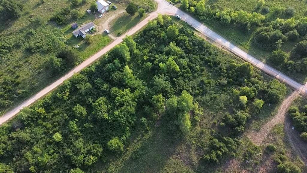 Two and a half wooded acres in east Norman — mature oaks, a quiet setting, and room to tuck a home back into the trees. Electric available. Lake Thunderbird and the state park sit just north for boat ramps, fishing and trails, Highway 9 is close for the quick run into Norman and OU, and I-35 is an easy connection from there. This tract is part of a larger 5-acre parcel and will be divided by survey at closing. Owner financing available with 10% down — call for terms. Covenants and survey in supplements; no active HOA. Owner is a licensed real estate agent. Buyers to verify all information.