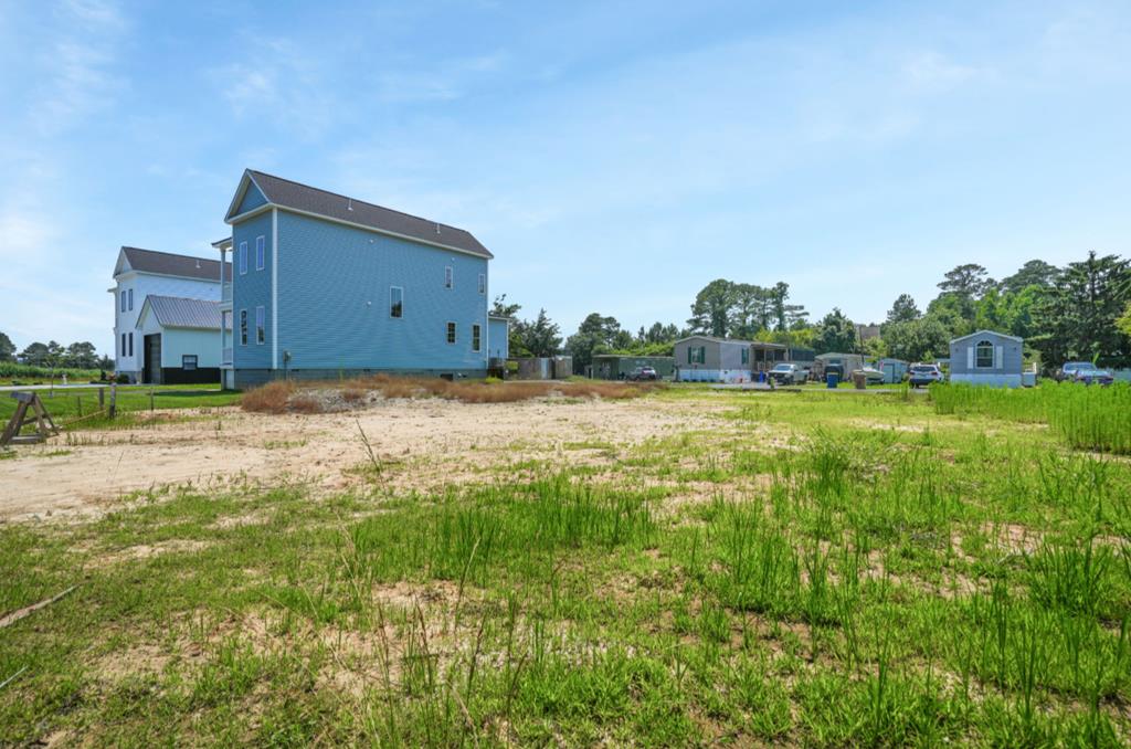 East Side Living! Bring your blueprints and your builder—NO HOA! This lot is ready for your island home. Situated on a quiet dead-end street just off East Side Dr, "On the Bend," it offers a perfect location to create your dream residence. The property includes an installed septic system designed for a three-bedroom home, water meter, and all land preparation has been completed. Build now or later—you have the flexibility to decide. The septic system is shared with 8046 Clarkson Ln, with each lot supporting a three-bedroom capacity. A septic and road maintenance agreement is recorded in the deed. Please note, manufactured homes are not permitted, but modular homes are welcome. 8046 Clarkson Ln, adjacent to this lot is also for sale. The sellers would consider a package sale. OWNER/AGENT