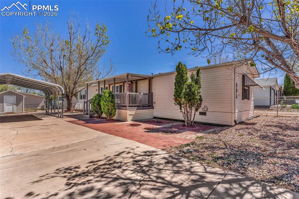 We found it! AFFORDABLE in 2026...check! Move-in ready...check! Updated home...check! In Pueblo West...check! Great fenced in yard...check! Spacious concrete driveway with 2 car carport...check! Mature shade tree(s)...check! This 3 bedroom, 2 bath home is almost too good to be true. Updated just a few years ago, there's laminate flooring in the living areas with newer carpet in the bedrooms and vinyl double pane windows. There's a spacious and open kitchen, dining and living room. Both bathrooms have been remodeled, plus there's refrigerated AC. Outside you'll find a low maintenance fully fenced yard with a carport and shed, then there's a quaint covered deck for your morning coffee. This one will go fast!! (*Some of the photos are virtually staged.)