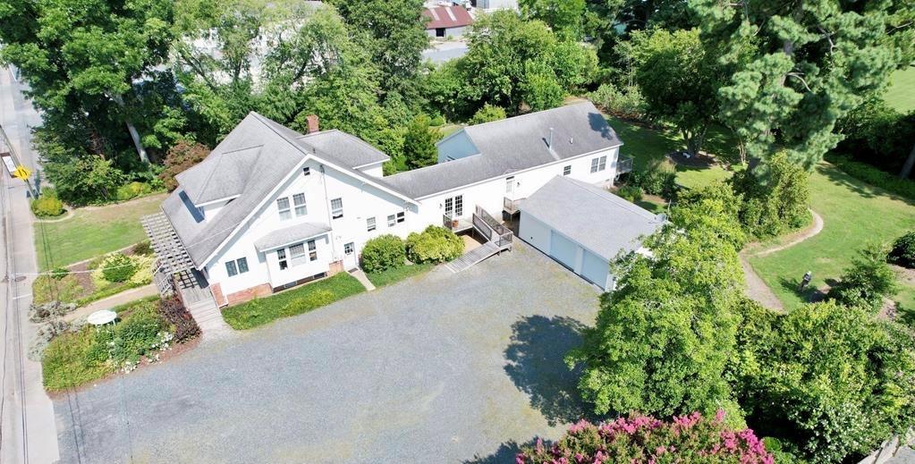 ECONOMIC ENTERPRISE ZONE –  COMMERICAL and RESIDENTIAL right on Market Street in highly sought after Onancock.   Situated on a 1+ acre lot this property offer space for a business with ample off street parking AND the potential for 2 residences.  This property is soooo much more than the expansive, stick built craftsman style home facing the street with a second residential unit addition comprised of 2 bedrooms and 2 baths, a multi car detached garage with work room.  This property is fenced on 2 sides with a park like rear and side yards perfect for entertaining or an outside venue.  YOU REALLY MUST see this property to take it all in.  OPEN HOUSE 10/10/25 2:30-4:30, stop by.