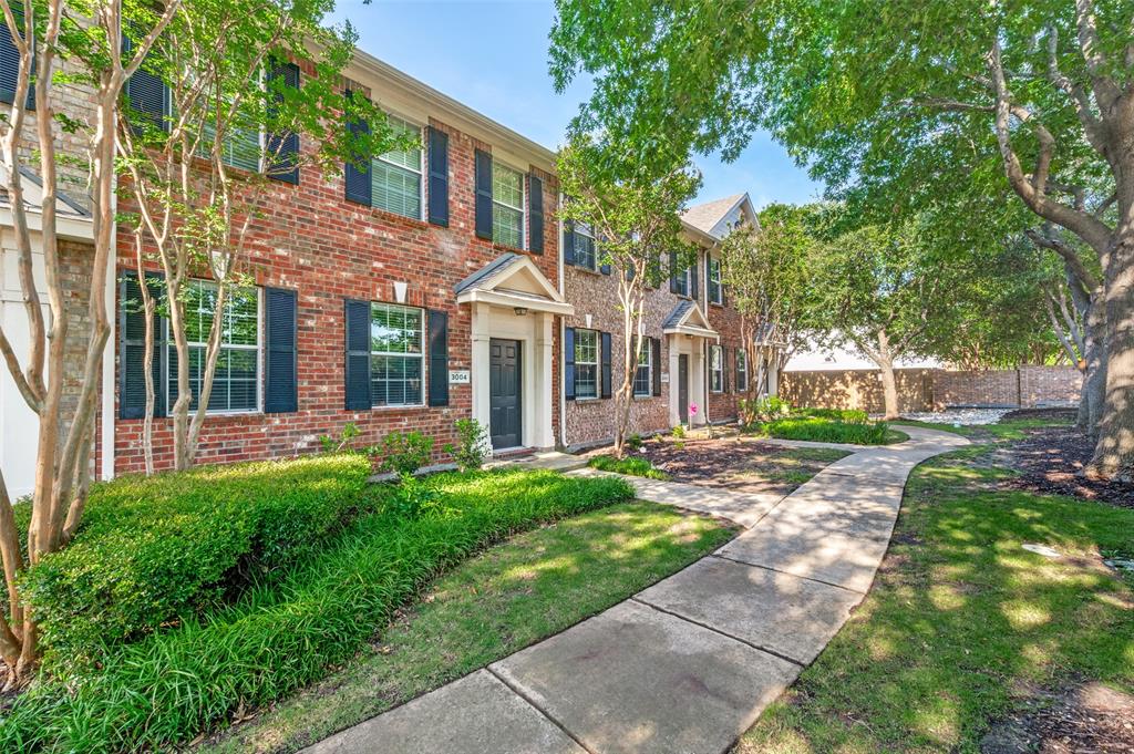 Welcome to easy living in the highly sought-after Pasquinelli’s Village on the Green — a charming, tree-lined community tucked in the heart of McKinney! This fabulous and inviting townhome offers the perfect blend of comfort, convenience, and low-maintenance living with beautiful mature trees, gorgeous curb appeal, and a prime location close to everything you love. Step inside and immediately notice the soaring 18-foot ceilings, abundant natural light, rich wood flooring, recessed lighting, and charming updates throughout. This spacious two-bedroom, one-and-a-half-bath home features an open and airy layout designed for comfortable everyday living and entertaining alike. The eat-in kitchen offers plenty of space for gathering, and the refrigerator, washer, and dryer all stay with the home for added convenience! Upstairs, you’ll find a versatile loft or game room space, an oversized utility room with extra storage, plus two spacious bedrooms and a full bath. Best of all — absolutely NO carpet anywhere in the home! Enjoy the ease of a rear-entry two-car garage and a lifestyle where the HOA maintains the exterior structure, making this an ideal low-maintenance opportunity for anyone looking for carefree living. Charming, updated, spacious, and move-in ready — this fabulous McKinney townhome is ready for its next owner to call it home!