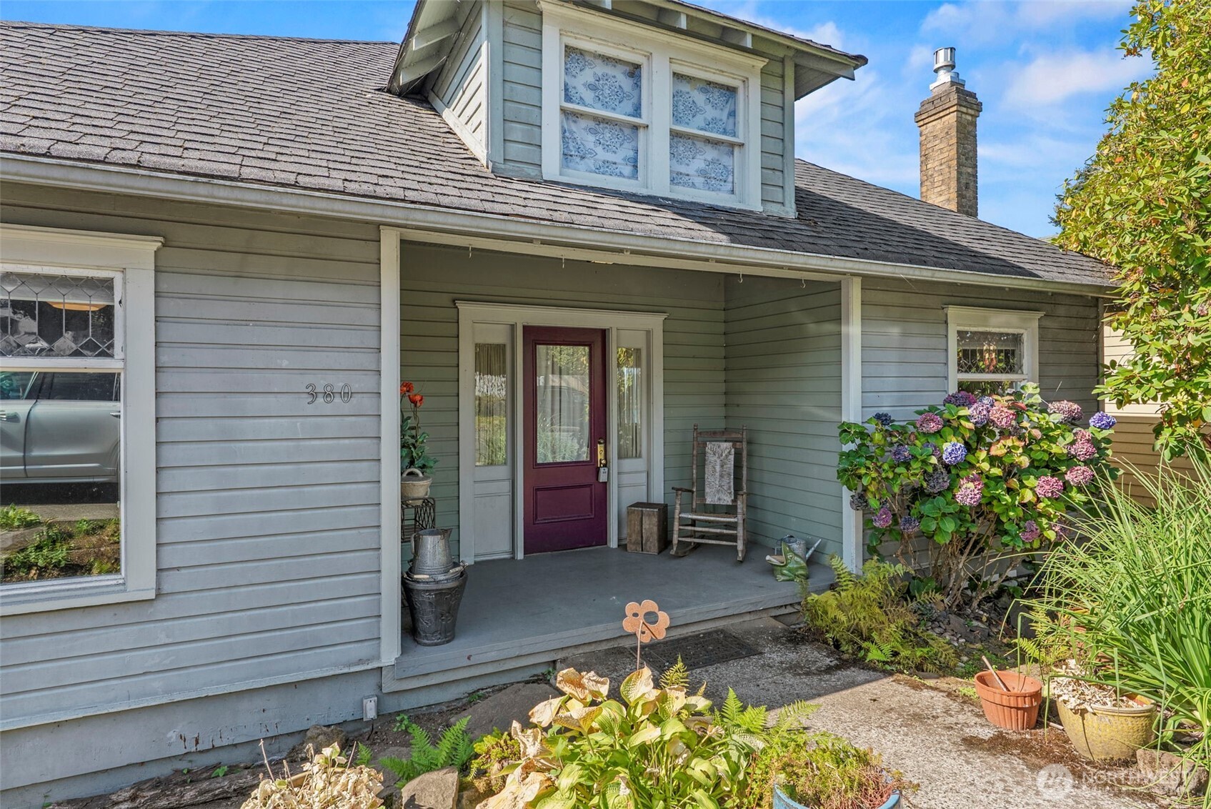 Columbia River Views, Classic Charm & Endless Possibilities! Discover this timeless 1920s Portland Bungalow-style home. Offering nearly 2,500 sq ft, this 3-bedroom, 2-bath home blends character, comfort, and versatility with stunning Columbia River views and beautiful sunsets. The main level features new carpet and inviting living spaces, while the lower level offers a bedroom, full bath, and kitchen that have been newly updated along with the electricity and electrical panel. — ideal for guests, multi-generational living, a private retreat, or potential rental/ADU use. Upstairs, a spacious bonus area with plumbed water which can provides flexibility for a home office, art studio, hobby room, or additional living space. Enjoy an oversized laundry room, abundant storage, and a mature-lush backyard with shade trees, and multi-level decks. Relax outside while taking in the river views, watching birds, or enjoying the peaceful sounds of nature. Close to downtown Cathlamet, parks, local shops, restaurants, and outdoor recreation, with easy access to Puget Island. This is a true 1920s gem offering charm, flexibility, incredible views, and room to make it your own. Come see why 380 Columbia Street is a must-see!