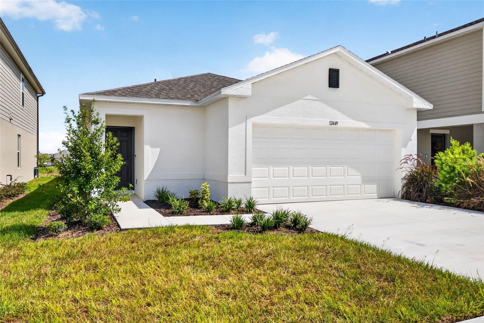 WHAT'S SPECIAL: Larger Backyard | Convenient 1st-Floor Living | Flex Room | Cul-de-Sac Lot | South-Facing Lot | New Construction – Ready Now!Welcome to 12449 Whisk Court in Palm Wind—where thoughtful design meets the ease of one-level living and an exceptional homesite.This beautifully designed Spruce floor plan offers a bright, welcoming layout with a spacious foyer leading naturally into the heart of the home. A versatile flex room opens to the main living area, creating an ideal space for a home office, den, hobby room, or additional gathering area.At the center of the home, the kitchen flows seamlessly into the dining space and great room, creating an inviting open-concept environment designed for both everyday living and entertaining. Sliding doors lead outside to the patio and the larger backyard, extending the living space outdoors.Two secondary bedrooms and a full bathroom are conveniently positioned just off the kitchen, while the private primary suite is thoughtfully tucked toward the rear of the home. The spacious suite features an en-suite bath and a generous walk-in closet, creating a comfortable retreat at the end of the day.The homesite is another standout feature, offering a cul-de-sac location, larger backyard, and south-facing lot—a combination that adds to the appeal of this new-construction home.Palm Wind in Hudson, Florida, blends small-town coastal charm with modern community living. Planned amenities include a pool, cabana, tot lot, open lawn, butterfly garden, and dog park, while Hudson's beautiful Nature Coast setting provides opportunities to enjoy the area's natural surroundings, outdoor recreation, and relaxed coastal lifestyle.Additional Highlights Include: GE refrigerator, washer and dryer, whole-house blinds, and extended tile flooring throughout the main living area.New construction. Ready now. A versatile flex room, convenient first-floor living, a larger backyard, and a cul-de-sac homesite—12449 Whisk Court is ready to welcome you home.