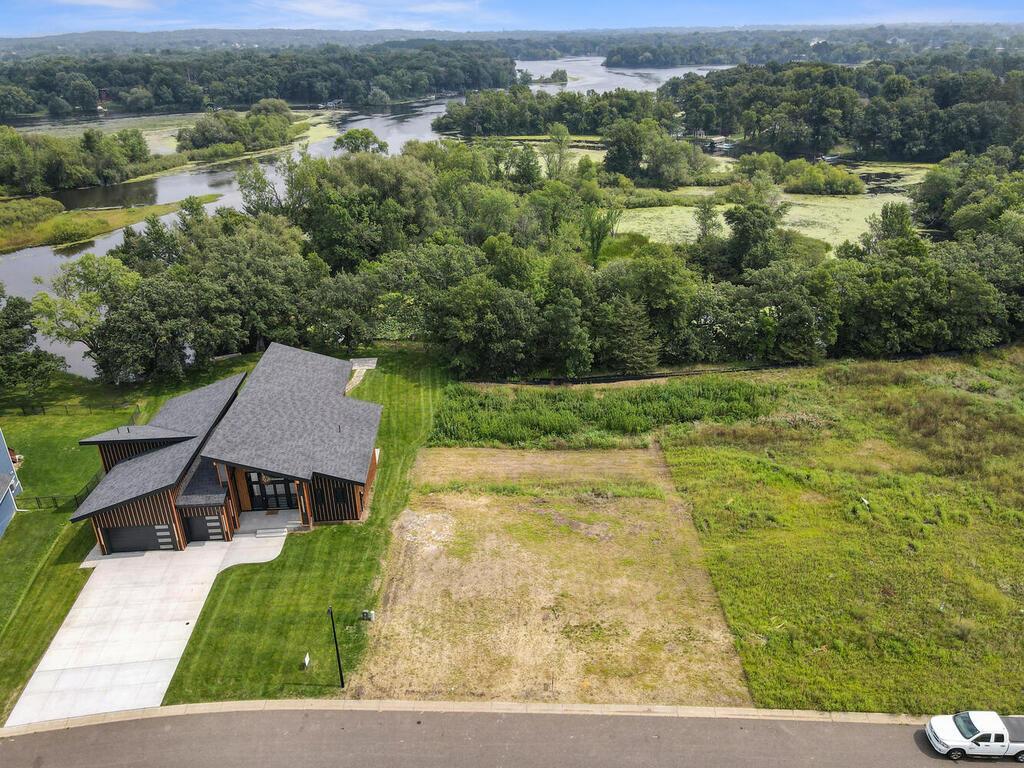 Beautiful Walk-Out Lot - Ready for you and your Builder.   Priced below current market value. Wildlife galore. Water flows in from Elk River and the Channel is 2-3 feet deep at properties edge, which can take you to Upper Orono Lake. Bring your kayak, or small fishing boat to catch walleyes, bass or just enjoy the peace and quiet.  Additional pictures will be available Tuesday Aug 12.