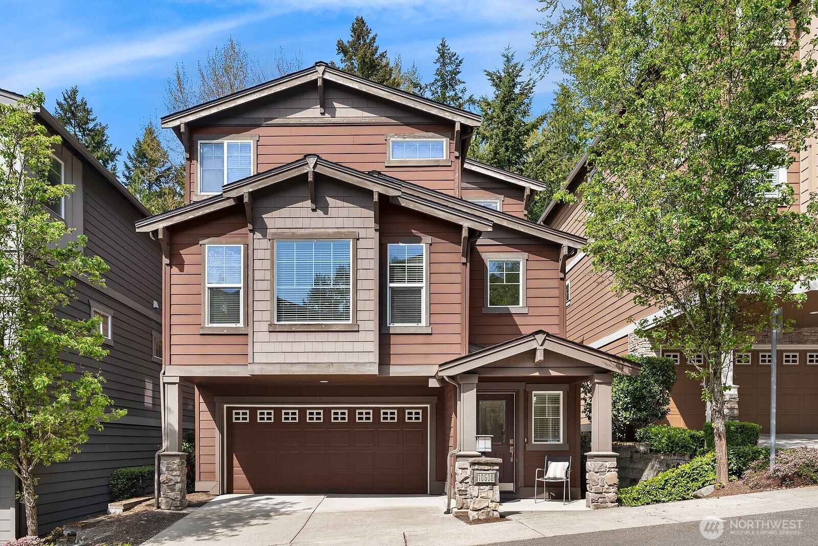 Exceptionally rare central Bellevue home with a premium layout in this area. South-facing home (3 bed / 3 bath) with a spacious main level featuring living and dining areas with large windows and strong natural light, flowing into kitchen with island, slab counters, full-height backsplash, and adjacent eating space. Kitchen includes direct access to outdoor patio/porch, supporting indoor-outdoor flow, ventilation while cooking, and easy access for grilling and entertaining. Living room windows face a neighborhood cul-de-sac, offering a quieter outlook away from main road traffic. Main level layout supports work-from-home, daily living, hosting, privacy, and comfort. Upper level includes two bedrooms, each with ensuite bathrooms, separated by a central utility/laundry area. Primary bath includes dual vanities, adding convenience for shared use. Layout provides separation and privacy between bedrooms, enhancing comfort. Main level bathroom also includes shower functionality, adding everyday convenience for guests and flexible use. Location offers quick access to downtown Bellevue, Bellevue Square, I-405, I-90, WA-520 and South Bellevue light rail station. Nearby outdoor access includes Burrows Landing Park and waterfront recreation at Chism Beach Park. Close to shopping, dining, parks, and award winning Bellevue schools. Recent improvement includes a brand-new roof (2025). Sewer capacity charge is fully paid off. Low HOA dues.