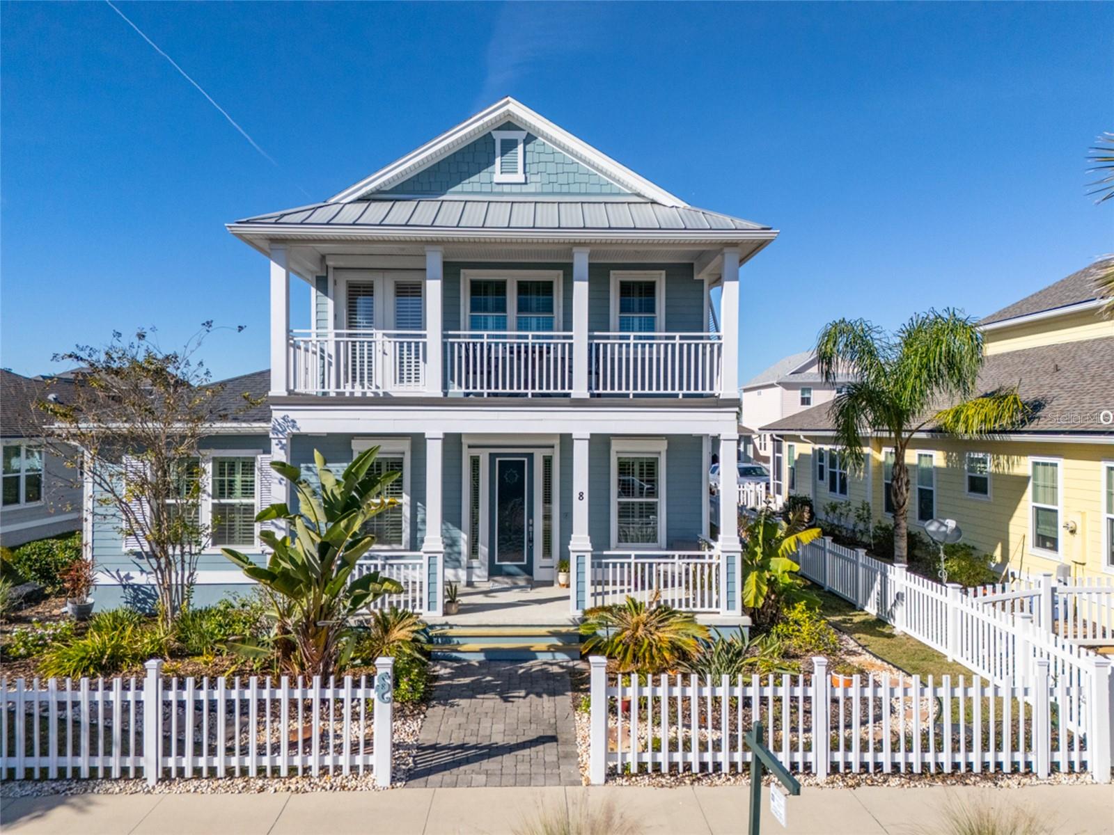 One or more photo(s) has been virtually staged. Enjoy the peaceful coast of Florida. Like this 4 bedroom, 4 bath home which is located along A1A Scenic & Historic Coastal Byway in Flagler County. Light and bright with an open floor plan plus a well maintained home. Enjoy a coffee with ocean breezes from your front porch overlooking the community pond. No need to drive to the community pool. It's a short walk across the street. The first level owner's suite has a huge 17x15 walk-in closet, large tub and separate shower. Crown moldings border the 10"ceilings. Glass entry doors, plantation shutters, impact windows, outdoor showers, and storm shutters, are just a few of the nice features to enjoy. A second bedroom is also on the first level. The second level is ideal for guests with a full bathroom, large loft, bedroom and a 4th bedroom/den option. Beach Haven is a modern gated community with a private beach access. Enjoy a beach walk 1 mile north to Marineland. Access road behind the home leads to the oversize garage with overhead storage and exterior parking area. Recently painted exterior (2023) and move-in ready. Available for a quick closing. Some photos have been virtually staged.