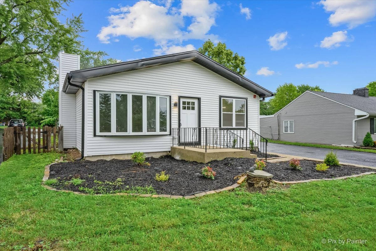 Recently renovated 5-bedroom, 4-bathroom split level home in the vibrant lake community of Wildwood in Grayslake, where year-round recreation and tranquil surroundings come together. Step inside to discover modern finishes and spacious living throughout, highlighted by an impressive eat-in kitchen with new cabinetry, sleek quartz counters, ss appliances, sizeable island, adjacent table space and attractive new LVP flooring that flows throughout all three levels of this spacious home. The generous living room is filled with natural light from large windows and showcases a stunning fireplace with floor-to-ceiling quartz surround. The main level offers a desirable primary suite complete with an updated ensuite full bath and walk-in closet, along with 2 additional bedrooms, another remodeled full bath and convenient same level laundry room. Upstairs you'll find two more spacious bedrooms and an updated full bath, providing flexible living arrangements for family, guests or a home office. The fully finished walk-out lower level expands the living space with a generous family room, renovated full bath and storage. Detached oversized 2 car garage featuring a level 2 charging setup offers day to day convenience and storage for all your summer toys. The sizeable yard offers endless possibilities and includes an in-ground pool being conveyed as is, ready for your personal vision and finishing touches. Many recent updates including new HVAC, hot water heater,  fire prevention system, cabinetry, vanities, kitchen appliances, extensive lighting, flooring and paint. Enjoy everything the Wildwood community has to offer including eleven parks, four swimming beaches, seven playgrounds, two boat ramps, nine fishing locations and three picnic pavilions for four-seasons of fun! Nearby shopping, restaurants, expressways and well rated Woodland schools make this location ideal.