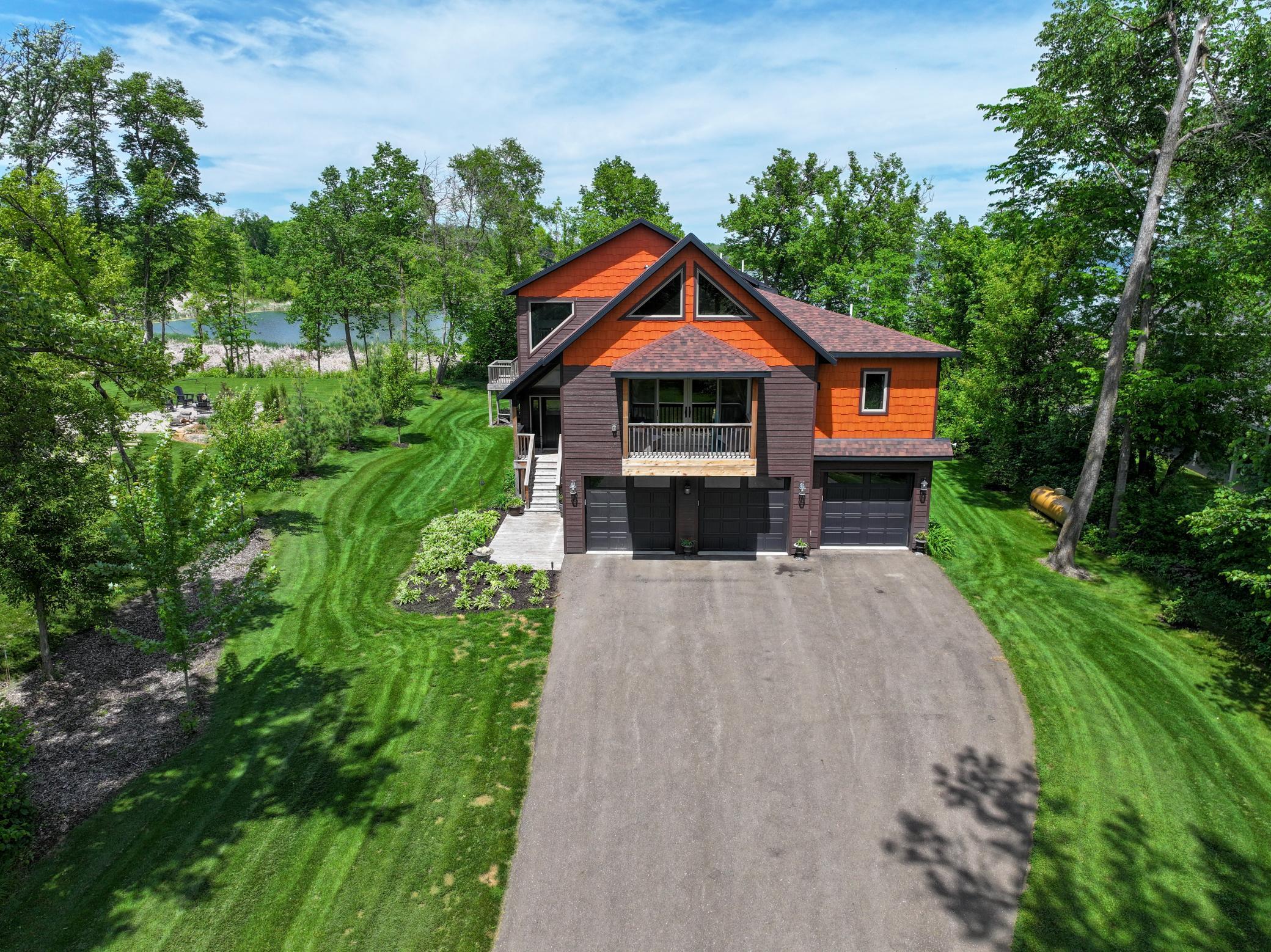 Beautiful home, tucked neatly on a 1.18 acre, wooded lot, has so much to offer:The outside living area features 2 - 30x13 cedar decks, a hot tub, a patio with a fire pit, in ground sprinkler system, and spectacular views of the lake!!The main floor living area is warm and cozy with a magnificent fireplace, a large dining area and a 22' snack bar that is ideal for a large crowd. The kitchen features custom cabinets,  a commercial stove, stainless steel appliances and 2 pantries.The Owner's Suite (1094 sq ft) features a private deck, fireplace and large bath and walk-in closet. It's a perfect retreat.The loft, with it's own bathroom,  works well as a bunk room but it could be a great office or exercise area.The 3 car garage (1094 sq ft) is large enough for a boat, it's  heated and insulated, with floor drains.There is an RV pad, for extra guests, with electricity and sewer hook ups.In the event that power is lost in the area; this home features a whole home generator so you can carry on with your usual routines. The Association access provides the dock, just bring your boat and get ready to enjoy life on Lake Ida!!
