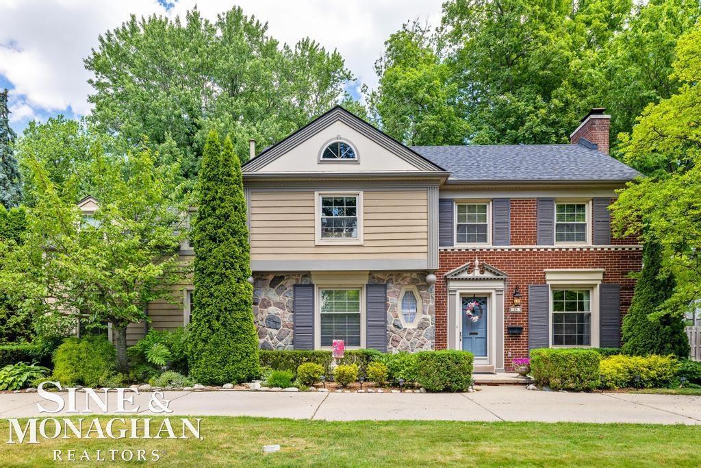 Welcome to this stately Colonial nestled in the heart of Grosse Pointe Shores. With timeless curb appeal and classic architecture, this spacious four-bedroom, two full bath, two half bath home offers comfort, elegance, and room to grow. Step into a welcoming foyer that opens to a sunlit formal living room with large windows and a wood-burning fireplace perfect for gatherings or quiet evenings. Expansive formal dining room that seamlessly flows into a lovely sun room. The kitchen features ample cabinetry, quartz countertops, stainless steel appliances, and a cozy breakfast nook. The sprawling sunken living room with built-ins also has a second fireplace that offers an inviting place to relax. Upstairs, you'll find four well-sized bedrooms, including a serene primary bedroom with plenty of closet space overlooking the back yard. Hardwood floors run throughout much of the home, complemented by traditional trim and thoughtful updates.The basement provides excellent storage and potential for additional living space. Outside, enjoy an oversized private backyard with mature trees, ideal for entertaining or unwinding. Two-car garage and circular driveway complete the package. Located just steps from Lake St. Clair as well as the resident only waterfront park and within the award-winning Grosse Pointe Public School District, this home offers the perfect blend of location, charm, and space. Don't miss this opportunity to make this incredible property your home.