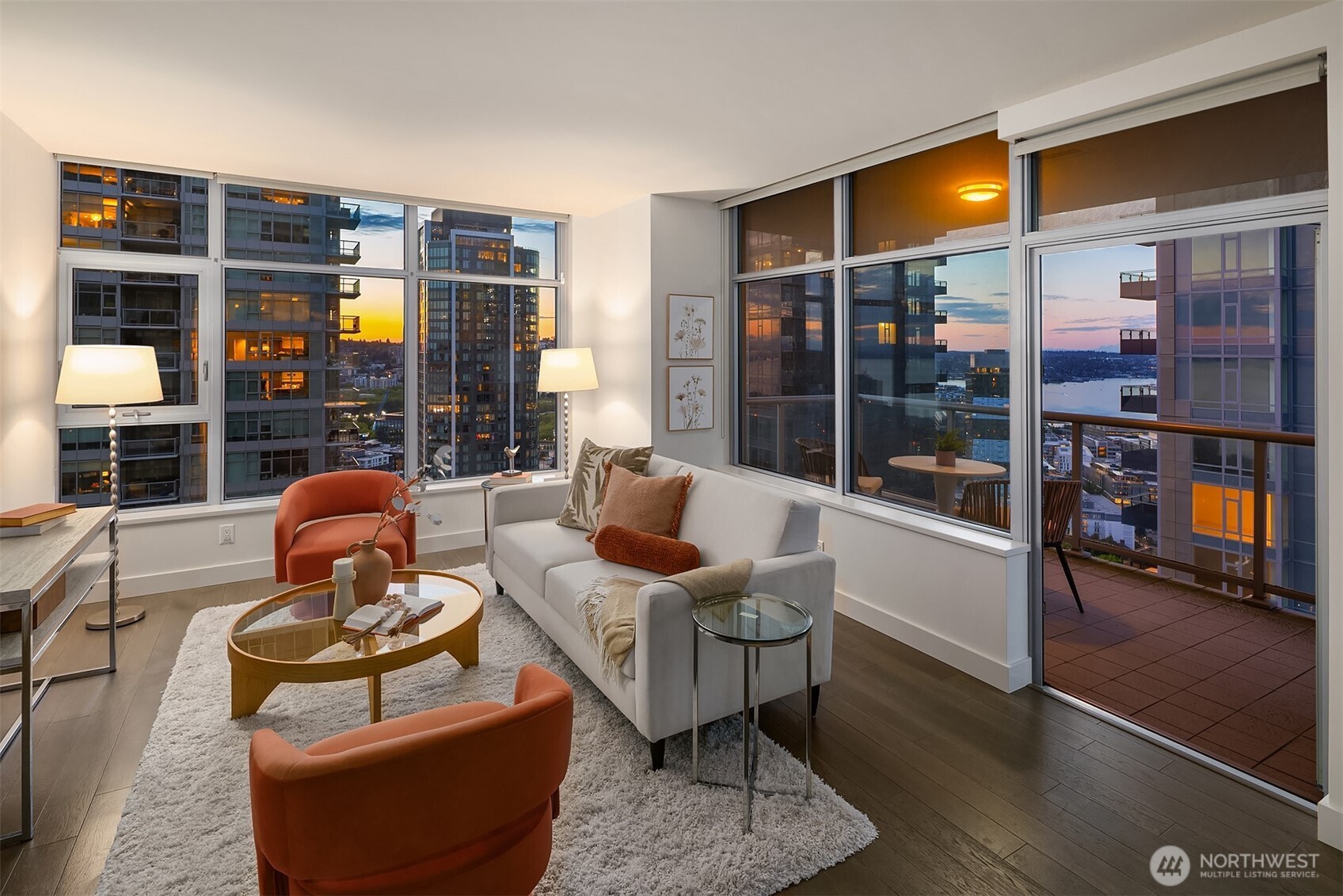 Experience elevated urban living at Insignia. This upper-floor corner 2-bedroom residence showcases wraparound views of South Lake Union and Elliott Bay through expansive floor-to-ceiling windows. The well-designed home features European-inspired cabinetry, sleek quartz countertops, Bosch and Thermador appliances, and a generous balcony ideal for indoor–outdoor living. Insignia’s resort-style amenities span two levels and include a state-of-the-art fitness center with dedicated yoga and pilates studios, indoor pool, hot tub and sauna, private theater, pet retreat, outdoor park with grills and fireplace, and a stunning rooftop lounge. Enjoy the ease of 24-hour concierge service and on-site car wash. Two parking spaces and storage included. Perfectly positioned moments from Belltown, South Lake Union and downtown with effortless access to major commuter routes, dining, and entertainment.
