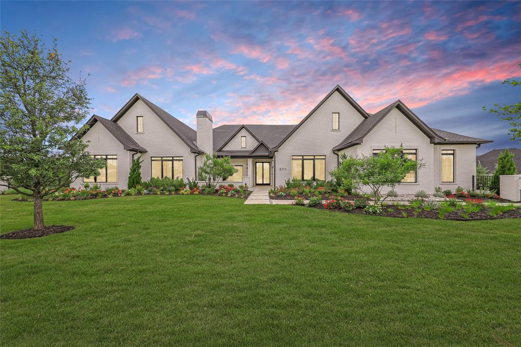 Experience luxury living at its finest in this stunning single-story estate featuring 5 spacious bedrooms, 5.2 bathrooms, and exceptional designer finishes throughout + OVER 1,200 ADDITIONAL SQUARE FEET of bonus space not in total square footage listed. Thoughtfully designed for both everyday comfort and elevated entertaining, this home offers an open-concept layout filled with natural light and breathtaking views of the beautifully landscaped backyard from nearly every room.At the heart of the home is a chef’s dream kitchen complete with double islands, high-end appliances, custom cabinetry, and an expansive back kitchen that keeps everything beautifully organized behind the scenes. The seamless indoor-outdoor flow leads to an incredible covered patio featuring a full outdoor kitchen, fireplace, and plenty of space to entertain year-round. Step into the resort-style backyard where a brand new pool, lush landscaping, and fully fenced yard create the ultimate private retreat.This home was designed with every lifestyle feature in mind, including a dedicated golf simulator room, private fitness room, media-theater room, and executive office. The luxurious primary suite offers a peaceful escape while each secondary bedroom includes its own ensuite bath for maximum comfort and privacy. Additional highlights include fireplaces in both the front courtyard seating area and backyard patio, a spacious 4-car garage, and premium finishes at every turn. Perfect location close to shopping, restaurants, and major roads!A rare opportunity to own an extraordinary one-story home that perfectly blends luxury, functionality, and resort-style living.