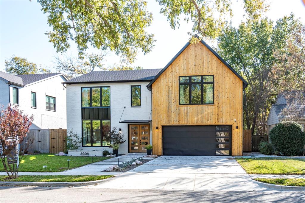 Completed in 2023, this modern traditional residence—crafted by D Best award-winning Potenza Homes—delivers fresh design, effortless flow, and coveted zoning to Mockingbird Elementary. The open-concept main level is anchored by soaring ceilings and an inviting living room wrapped in floor-to-ceiling glass, filling the home with natural light and seamless indoor–outdoor living. The chef’s kitchen features commercial-grade stainless appliances, a built-in microwave drawer, generous counter space, and a large center island designed to wonderful gatherings. The first-floor primary suite offers a serene retreat with a spacious ensuite bath and a thoughtfully designed walk-in closet complete with a secondary laundry area. A dedicated mudroom adds everyday convenience. Upstairs, an expansive open living area—large enough for a pool table—creates a flexible second living space, game room, or teen lounge. Four additional guest suites, each with ample space and natural light, complete the upper level. With five total bedrooms, multiple living areas, and a beautiful transitional modern aesthetic, this home blends style, function, and exceptional craftsmanship in one of East Dallas’s most desirable neighborhoods. Move-in ready and minutes from shops, dining, and the best of Dallas living.