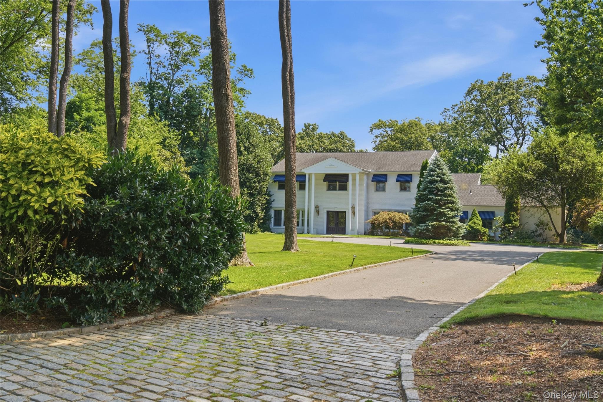 Waterfront residence in the Inc. Village of Lloyd Harbor. Set on two professionally landscaped acres at the end of a quiet cul-de-sac, 6 Lighthouse Point Road offers a rare opportunity to experience waterfront living in one of Lloyd Harbor’s most beautiful and serene settings. This five-bedroom residence takes full advantage of its waterfront location with bucolic water views. Custom-designed gourmet kitchen with center island, generous prep space and large dining area. Additional living spaces are wonderfully suited for entertaining including a spacious dining room and a family room featuring a dramatic cathedral ceiling and double-sided fireplace which creates a warm and inviting gathering space. The oversized primary suite features large windows that emphasize the abundant light and waterviews. Hardwood floors run throughout both the first and second floor. Outside, beautiful plantings surround an expansive waterfront patio with a gas fireplace—the perfect place to entertain, unwind, watch the boats come and go from the harbor, and take in the views. The peaceful waterfront setting and two acres of professionally landscaped grounds create an exceptional sense of privacy and connection to the water.Residents also enjoy the exceptional lifestyle offered by Lloyd Harbor Village, including Village Camp, tennis, beach and mooring privileges, along with a dedicated Village Police Department. A truly special Lloyd Harbor waterfront property combining space, privacy, natural beauty, and an extraordinary location on the water. Private Road Association (Dues Req'd)