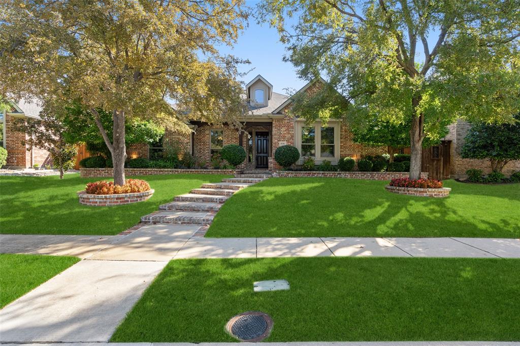 Splendid, Sweet and no other Equal!  Built in 2003, but thanks to recent upgrades, you'd never know it — Zoysa grass, newer roof, water heater and check out this $15,000 8-foot board-on-board fence. Can you say, Privacy? And how about $49,000 in Anderson windows throughout the home? Energy efficient, sleek, and quiet. It’s giving luxury — without the luxury tax, installed in 2025.  The kitchen open to the family room shares wonderful views of your private pool and is equipped with granite counter tops, a gas cook top and 42 inch cabinets.  Here you will find our inner Chef Emeril Lagasse.  A stone fireplace and nail down hardwood floors anchor the family room along with a surround sound environment.  The generous sized primary bedroom is where you will find solace after a long day.  Atop the list of amenities in the primary bath are quartzite countertops along with a spacious master closet.  Step into the wild of the outdoors and take sanctuary in your well curated backyard complete with a pool and spa.  Gorgeous landscaping and a covered patio add to its charm.  Lock this one in quickly as it should move fast.  Amazingly located near 121, DNT, Stonebriar Mall and the Shops of Legacy.