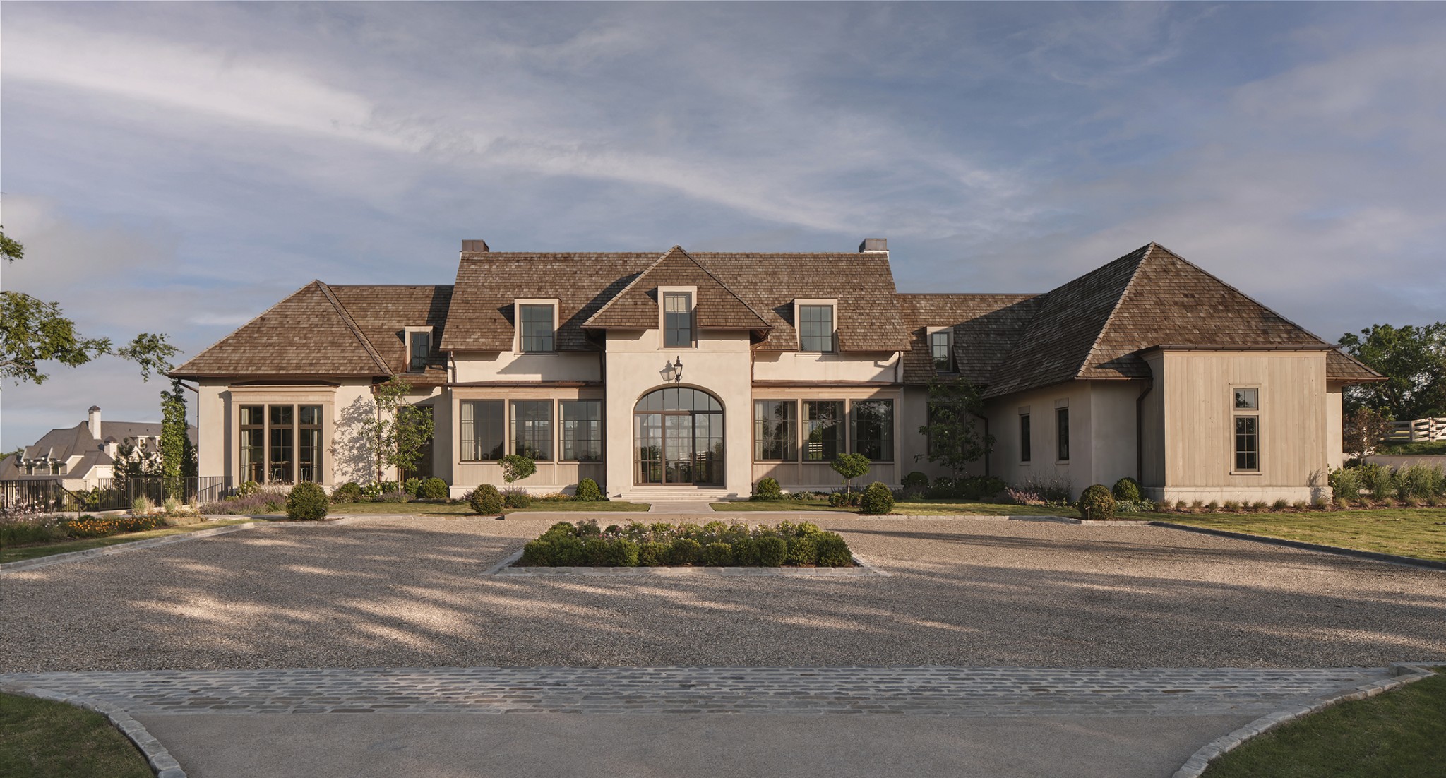 Exclusive opportunity for a custom home in the gated community of Harlan. This beautiful home nestled on over 3 acres is fully furnished.  Venetian plaster welcomes you into the grand foyer with site lines of scenic skylines and manicured grounds. The main level showcases many opportunities for family time and entertaining in the library or music room with seamless flow into the kitchen and living space. Design elements are layered with paint textures, white oak timber beams, limestone, white oak floors, and wallpaper which compliment the serenity of the home. The chef's kitchen includes Lacache range and mortar rubbed limestone backsplash accented by a plastered Tuscan hood. Notice the leathered Taj Mahal countertops, and Subzero white oak paneled fridge and freezer. The scullery includes a wine fridge, Miele microwave and oven, Cove dishwasher, and appliance garage. The main level primary suite is captured by Venetian plaster with a barrel vault ceiling and mortar rubbed limestone fireplace. The primary bath has a Tadelakt shower, heated floors  and his and hers vanities. The primary wing is encased with his and hers large walk in closets that flow into the laundry room. The main level also has 2 drop zones, a dog washing room, laundry and fridge for the pool/outdoor grill. The guest bedrooms are all on the second story with unfinished space for a fifth bedroom or an upstairs primary suite with additional space for storage. There is a kid's den with a half bath and upstairs laundry room. The built in bunk room is great for sleepovers.The basement is equipped with a gym that rivals Equinox, a treatment/meditation room, sauna, shower, and cold plunge area. Practice your golf swing with the Trackman golf simulator. Note the storm shelter with electricity. The pool cabana and outdoor kitchen make every day ideal for the family lifestyle. Enjoy the resort style pool and hot tub, lounge in the pool cabana or play pickleball on the sports court.