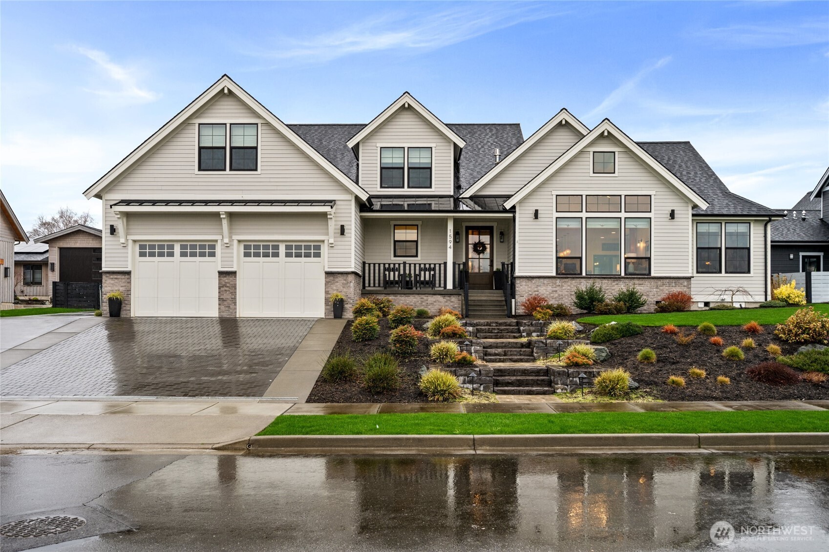 1594 Farmview Terrace is a beautifully designed custom home, thoughtfully maintained and ideally located on the outskirts of Lynden. This inviting property offers 4 bedrooms and 2.5 baths, along with a recreational room and dedicated den/office, providing flexible space for everyday living, work, and entertaining. Vaulted ceilings and abundant natural light create an airy, welcoming atmosphere throughout the main living area, centered around a spacious chef’s kitchen. The kitchen features an ActivWall that opens to the covered back patio, creating a seamless indoor-outdoor living experience perfect for gatherings or relaxing evenings at home. The property includes a two-car garage, parking pad, and recently upgraded driveway, offering ample space for vehicles and guests. The fully fenced backyard is nicely landscaped and designed for comfortable outdoor living. Situated on .34 of an acre, the property also offers room to expand with potential for a future ADU or shop. Recent improvements to the front landscaping further enhance the home’s curb appeal and long-term value, reflecting the care and pride of ownership throughout.