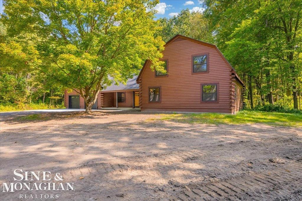 DISCOVER THE PERFECT BLEND OF RUSTIC CHARM AND MODERN UPDATES WITH THIS "LIKE NEW" PROFESSIONALLY REMODELED 4-BEDROOM, 2.5 BATH LOG HOME, NESTLED IN ON 16.65 ACRES OF PRIME WOODED LAND. THE INTERIOR SHOWCASES THE WARM AND NATURAL CHARACTER OF THE LOG CONSTRUCTION AND FEATURES MODERN FINISHES. THE STUNNING HICKORY KITCHEN IS ACCENTED WITH THE NEWLY POPULAR LEATHERED GRANITE COUNTER-TOPS. LUXURY VINYL FLOORING FLOWS THROUGHOUT THE FIRST FLOOR- THE GREAT ROOM FEATURES TIMBER CEILINGS AND LOG WALLS ALL FRESHLY STAINED TO HIGHLIGHT THEIR BEAUTY AND A WOOD STOVE FIREPLACE WITH A STRIKING NATURAL STONE HEARTH, CREATING A WARM AND COZY ATMOSPHERE. FIRST FLOOR PRIMARY SUITE FIRST FLOOR LAUNDRY AND HALF BATH- 3 SPACIOUS UPSTAIRS BEDROOMS WITH A CONVENIENT HALL BATH- EVERYTHING IS BRAND NEW INCLUDING ALL OF THE INTERIOR FINISHINGS, FURNACE, TANKLESS HOT WATER HEATER, ROOF, GUTTERS, WINDOWS, CONCRETE PORCHES AND DRIVEWAY APPROACH, GARAGE DOORS, WATER SOFTNER, THE YARD FRESHLY GRADED WITH GRASS SEED, THE POND WAS REFRESHED AND RE-DESIGNED, NEW GRAVEL CIRCLE DRIVEWAY, OVER SIZED ATTACHED 2.5 CAR GARAGE, UNFINISHED BONUS ROOM ABOVE THE GARAGE- PAVED ROAD -NATURAL GAS.