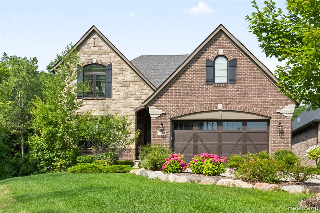 Welcome to your dream home in one of the area’s most desirable communities. This stunning 2-story residence blends timeless elegance with modern design, nestled on a beautifully landscaped lot in a quiet, upscale neighborhood. From the moment you step into the impressive 2-story foyer with a cathedral ceiling, you’re greeted with an air of sophistication. Just off the entry, a private den offers the ideal space for a home office or cozy retreat, while a nearby powder room adds convenience for guests. Hardwood floors lead you through the open-concept main liv area, where natural light pours into the soaring two-story family room. A striking gas fireplace with elegant marble anchors the space, creating the perfect setting for both entertaining and everyday living. The chef’s kitchen is a showstopper—feat stainless steel appliances, large center island, walk-in pantry, and abundant cabinetry. The adjacent din nook provides a welcoming space for casual meals, while still feeling connected to the action. Around the corner, the spacious laundry room is fin with granite countertops, an undermount sink, and storage cabinets. The lux 1st -floor owner’s suite is your personal sanctuary, complete with a generous walk-in closet, a spa-inspired bath with a freestanding soaking tub, and private access to the lanai—perfect for enjoying morning coffee or winding down in the evening. Outside, enjoy curb appeal with lush landscaping, a wide driveway, and a backyard ideal for relaxing or entertaining. Whether you’re hosting a summer barbecue or enjoying the quiet breeze under the covered lanai, this outdoor space is as functional as it is beautiful. Located in a sought-after neighborhood known for its scenic walking paths, top-rated schools, and easy access to dining, shopping, and major expressways—this home offers the perfect balance of privacy and convenience. This is more than a home—it’s a lifestyle. Don’t miss your opportunity to own in one of the area’s premier communities.