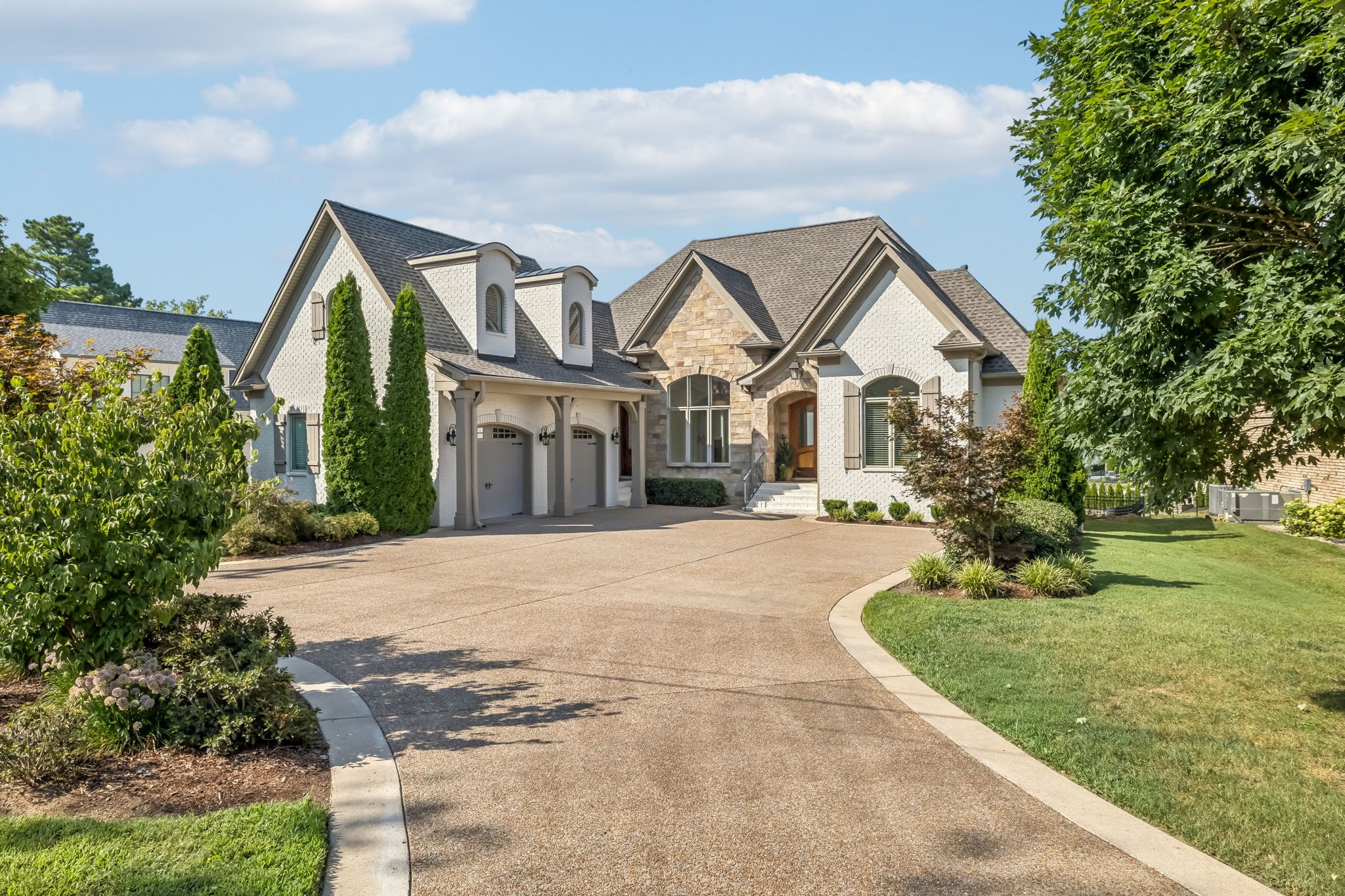 Lakefront Living at Its Best! Stunning 5BR/4BA lake house with covered boat slip on Old Hickory Lake 20 min from Nashville.Experience the ultimate in lakeside living on the serene shores of Old Hickory Lake. Featuring a walk-out basement that leads directly to your boat, this property is perfect for water enthusiasts and those seeking a peaceful retreat just 15 minutes from the airport.The home boasts breathtaking lake views with abundant natural light, an open-concept living area ideal for gatherings, with primary and a guest bedroom conveniently located on the main level. The fully finished basement offers additional entertaining space with 2 bedrooms, 2 full baths, a bar area with a wine cooler, an office, and a recreation room, providing ample room for fun and relaxation. An upper-level retreat features a spacious bedroom with two closets and a half bath. Brand new roof.With its prime location and tranquil setting in a peaceful cove, this lakehouse is the perfect getaway for families, friends, or anyone looking to unwind in a lakeside paradise.