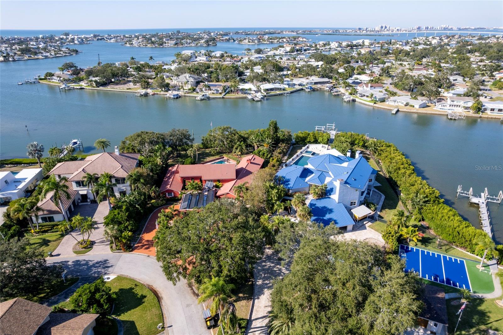 Exceptional waterfront estate located in the exclusive Kings Point community of Largo. Situated on an expansive and private lot, this impressive residence offers a rare combination of space, privacy, and water views. The home features a grand layout with multiple living and entertaining areas, generously sized bedrooms, and abundant natural light throughout.single-family residence was built in 1986 and sits on a generous 1.22-acre lot in a private setting. The property offers nearly 12,000 square feet of living space (approx. 11,994 sq ft) with a sprawling floor plan that includes 6 bedrooms and 8 bathrooms, making it ideal for large families or multi-generational living. Movie Room, Wine Cellar, Elevator and MORE