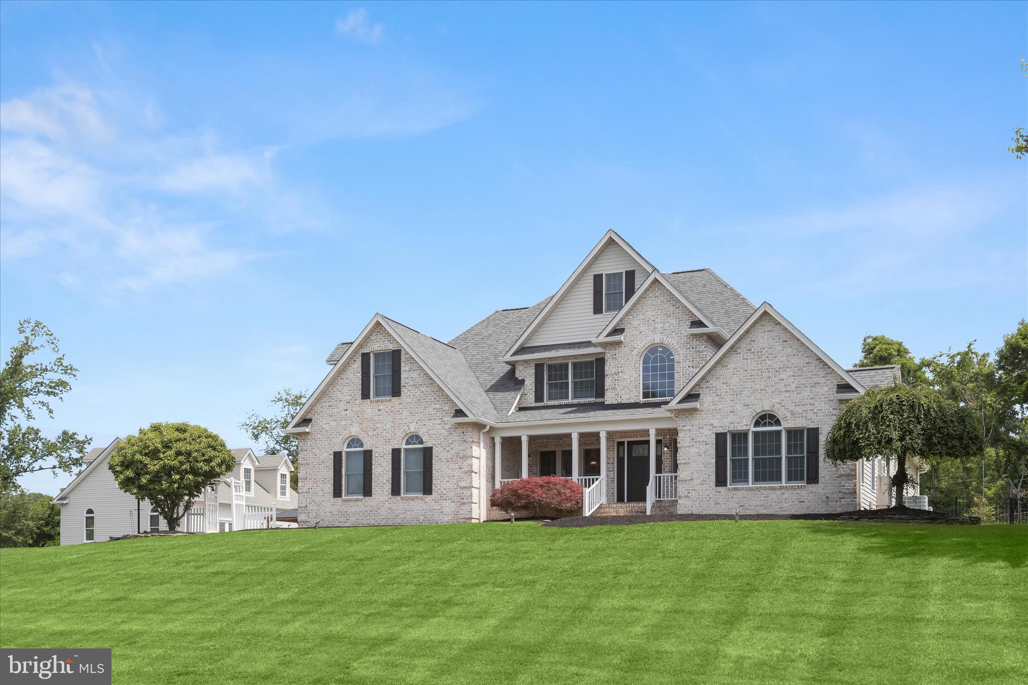 Welcome to 3003 Sheffield Court, a truly extraordinary residence offering luxury, flexibility, and unparalleled entertaining space in a private Fallston setting. Thoughtfully designed for both everyday comfort and unforgettable gatherings, this one-of-a-kind property combines exceptional craftsmanship, resort-style amenities, and remarkable versatility to create an unmatched living experience.A dramatic two-story foyer sets the tone for the home and is beautifully anchored by formal living and dining rooms filled with natural light. Rich architectural details enhance the main level, including elegant box wainscoting, substantial 5-inch trim and moldings, and custom finishes that create a refined yet welcoming atmosphere. Dual staircases provide both elegance and functionality, with one staircase creating a grand focal point in the foyer and the second offering convenient access from the kitchen.At the center of the home, the gourmet kitchen is designed to impress. Crisp white cabinetry, quartz countertops, stainless steel appliances, a large center island, and a walk-in pantry provide both beauty and function. A striking custom range hood serves as a standout feature above the gas cooktop, while the microwave and oven are seamlessly integrated into a sophisticated wall cabinet arrangement. Just beyond the kitchen, a sunny breakfast area surrounded by windows offers the perfect setting for casual meals while enjoying views of the surrounding landscape.The luxurious main-level primary suite serves as a private retreat, featuring refinished hardwood flooring, a cozy propane fireplace, dual closets, private outdoor access, and a beautifully updated spa-inspired bath with a soaking tub and oversized walk-in shower. The upper level offers four spacious bedrooms, thoughtfully designed with two dual-entry full baths, each shared by a pair of bedrooms. A spacious bonus room and finished loft area add exceptional flexibility, creating the perfect space for a media room, playroom, study area, fitness room, or additional lounge space.The impressive lower level was designed with entertaining in mind and features a custom bar, kitchenette, expansive recreation spaces, a bonus room or office, gym area and a fully soundproof theater room complete with luxury seating and a big-screen television, creating the ultimate at-home entertainment experience.Step outside to discover a spectacular private backyard oasis centered around a brand-new 56-foot by 26-foot resort-style saltwater pool. Designed and installed by Elite Pools, this exceptional feature showcases an EcoFinish surface, smartphone automation, an Elephant walk-on pool cover, and a breathtaking 50-foot waterfall. Expansive hardscaping, a fire pit, gazebo, hot tub, lush landscaping, and privacy fencing complete the outdoor retreat. Adding even greater convenience, pool maintenance and closing services have already been paid for the current season.Enhancing the property's incredible flexibility is a detached three-level guest house and garage complex, accessed by its own separate asphalt driveway. The lower level features a three-bay garage and workshop with commercial-grade electrical service. The main level offers an expansive party room complete with a kitchenette, full bathroom, and laundry area, while the upper level provides a private guest suite with a full bath. Whether utilized for multi-generational living, extended guest accommodations, a home-based business, a car collection, hobbies, or large-scale entertaining, this remarkable structure offers endless possibilities.Extensive updates include Bosch HVAC systems, renovated kitchen and baths, updated flooring, custom trim work, a finished lower level, and a newly installed resort-style pool, creating a truly exceptional Fallston property. Note:  Select interior photos have been virtually staged.