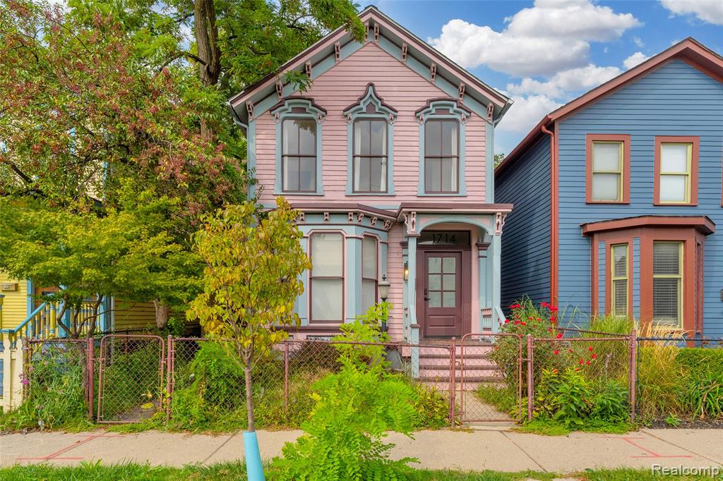 Looking for space, style, and location? This single-family gem checks every box. This exquisite 1880 blush-colored Victorian has been reimagined into a modern masterpiece in Detroit's Historic Corktown neighborhood steps from Michigan Central, Artclvb, Stoned Cold Nails, Folk, Metaphysica Wellness, James Oliver Coffee and so much more!! The interior has soaring ceilings, fresh interior paint, new engineered oak flooring throughout, design forward globe style lighting fixtures, updated electrical and plumbing + reinforced foundation. In the rear of the home, find a stunning kitchen remodel with new stainless steel appliances, a spacious center island anchoring the room - perfect for casual dining, meal prep, or entertaining. The eye catching herringbone patterned flooring adds a sophisticated touch, creating visual interest and elevating the entire space. Just off the kitchen, a windowed door opens to a sprawling wooden deck, nestled beneath the canopy of a mature tree with multiple seating areas perfect for morning coffee, sunset dinners, or weekend gatherings. Convenient first floor laundry and entry level home office that could be converted into the home's 4th bedroom. The second level offers 3 bedrooms and 2 full bathrooms, the primary bedroom having southern facing views, large beautiful windows, and a generous sized bathroom complete with a soaking tub, stand up shower, and double sink vanity. Ample closet space throughout and basement can be used for additional storage. Off-street parking available in the fenced in backyard. Contact us to schedule a private showing and secure a spot in one of Detroit's most desirable and dense neighborhoods, just west of the heart of the bustling and lively downtown area.