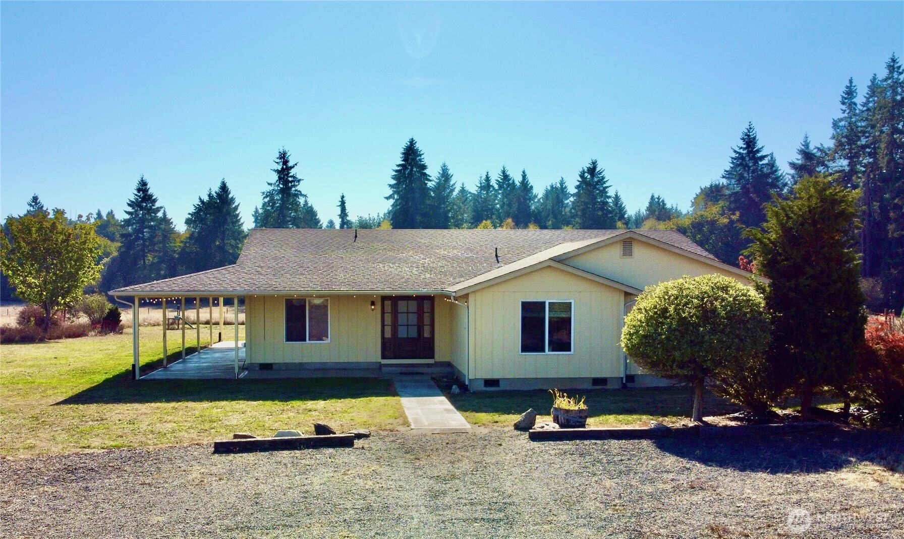 Discover peaceful country living at its finest! This property sits on over 5 serene acres in the heart of Winlock, offering privacy, space, and versatility. This ramble offers 4 beds 2.5 baths with spacious open-concept layout perfect for anyone seeking rural tranquility without sacrificing comfort. Enjoy the covered front deck with sweeping territorial views, ideal for relaxing or entertaining. Fully fenced lot making it ideal for animals, hobby farming, or recreational use. Includes multiple huge outbuildings for storage or workshops total of 4,721 sqft. Easy access to I-5 for commuting to Chehalis, Olympia, or Portland.