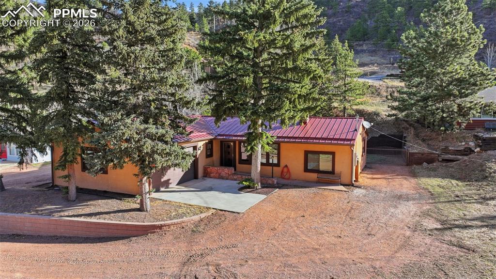 Tucked away in the scenic foothills of Green Mountain Falls, this charming mountain retreat at offers the perfect blend of peaceful mountain living with convenient access to everyday amenities. Surrounded by towering pines, fresh alpine air, and beautiful natural scenery, this home provides the serenity of a true Colorado escape while still being just minutes from Woodland Park and a short drive to Colorado Springs.Enjoy the best of both worlds — quiet mornings, cool mountain evenings, and nearby hiking trails, yet close to shopping, dining, schools, and medical services. Whether you're looking for a full-time residence or weekend getaway, this location delivers the ideal balance of privacy, nature, and accessibility.Experience the lifestyle people move to Colorado for — mountain views, peaceful surroundings, and convenience all in one location.Things to know - this home has a newer metal roof, new radon system, upgrade electric panel, and so much more!