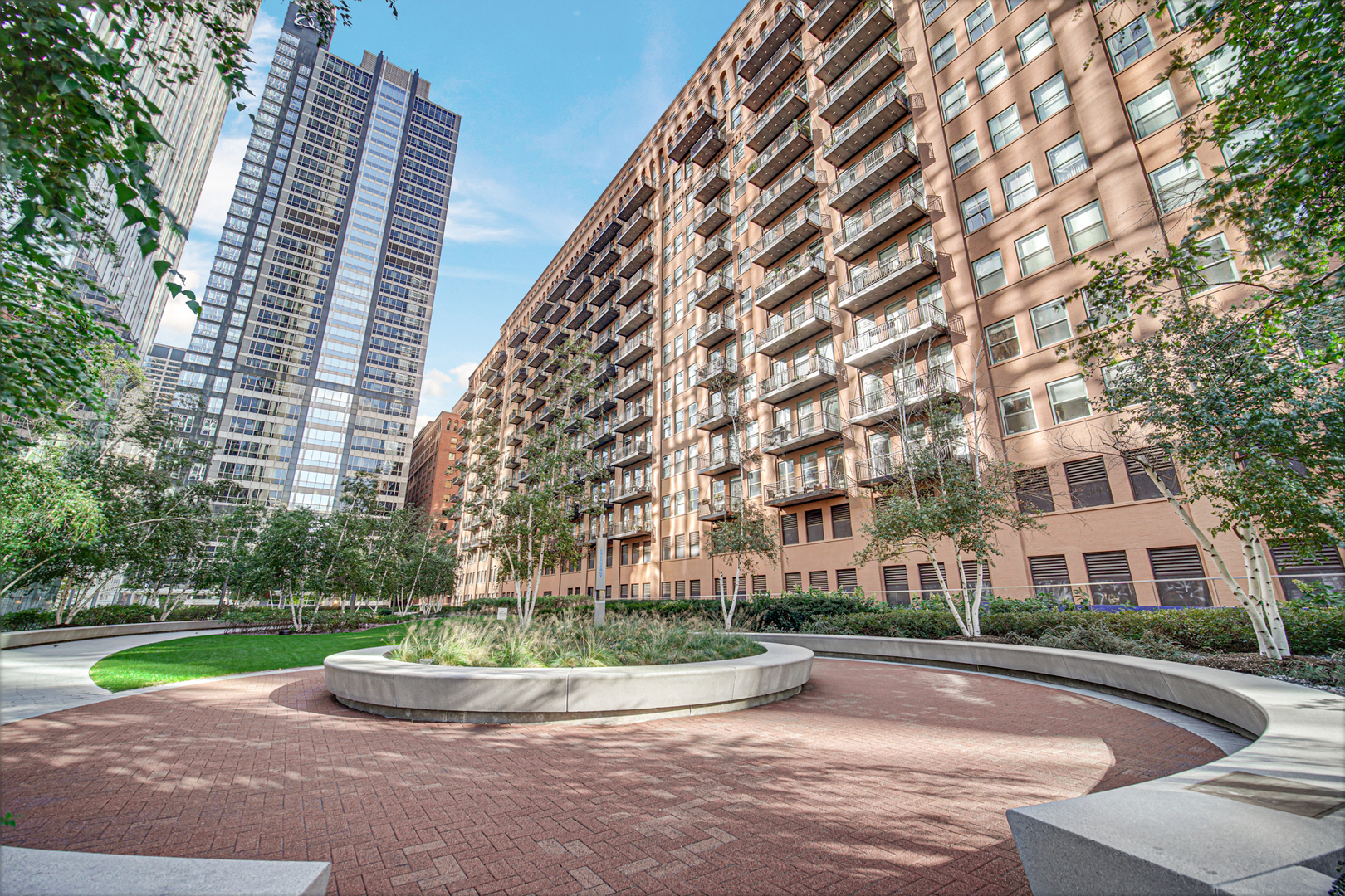 Chicago Condo with River & City Views!                            **Not on Metra side of the building**    Come check out this bright Eastern exposure 2-bed, 2-bath condo with 1,600+ sq. ft. of updated living space. Over $100,000 of updates with new AC, updated modern kitchen - new cabinets, quartz counters, backsplash, refrigerator, and waterfall island. The laundry room has a full-size washer and dryer, with ample storage. Building & HOA Amenities: 24-hour door staff, large fitness/exercise room, Amazon package lockers, WiFi, cable, and water included. Easy access to Kennedy/Dan Ryan Expressways, 14 miles to O'Hare, 10 blocks to Lake Michigan, near Fulton Market, River North, premier shopping, dining, and theaters. Modern updates, stunning views, and full HOA amenities make this an ideal Chicago home. Main-floor, extra-wide, heated garage parking space #51 is deeded separately and available for an additional $25,000. The parking space is  an additional HOA of $55. Unit is rentable after one year of ownership when rental cap has not been met. The sellers will miss this great condo; they're moving for an exciting job opportunity.