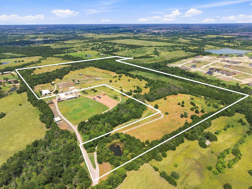 Beautiful Horse property located minutes from I-30.  INCREDIBLE INVESTMENT OPPORTUNITY!  SELLER will also sell 15 ACRES FOR $1,550,000. The land is AG Exempt, features 2 PONDS and is located in very sought after ROCKWALL, TX. If you've ever wanted to have your own little piece of Heaven in the country without being too far out, this is the one for you! Do you want enough land for your entire family to have their own lots to build on, here you go!  Great schools, fabulous shopping, boating on nearby beautiful Lake Ray Hubbard, all within minutes of downtown Dallas. This property also comes with a 2 Bedroom, 2 Bath Bardominium, a 12 Stall Barn, and 4 Loafing Sheds!