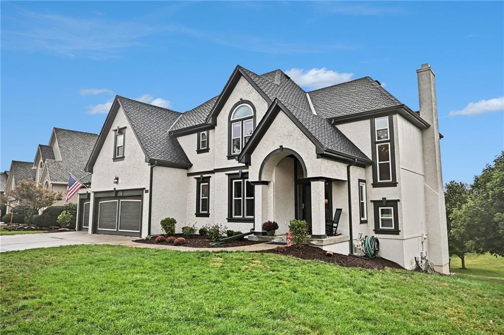 COME AND ENJOY THE BEST OF THE RISS LAKE COMMUNITY IN THIS EXCEPTIONAL TWO STORY HOME!  From the moment you step through the front door you will LOVE the feel and finishes.  The main level offers panoramic sunset views from the living room, kitchen and dining areas. Spacious and comfortable with hardwood flooring and a cozy fireplace in the hearth room. The kitchen delivers with custom painted cabinets, granite countertops loads of storage and stainless appliances. Convenient laundry room and an updated half bath just off of the kitchen. Walk out to the spacious and NEW upper deck to enjoy your morning coffee!  The upper level features large bedroom sizes, walk-in closets and an owner's suite that is sure to impress with it's sliding barn door, fireplace and new ensuite bath tile.  The walkout lower level has a HUGE rec. room that is perfect for sleep overs along with a convenient 5th bedroom and plenty of storage.  Gather on the patio to enjoy cool Fall evenings and enjoy the great views. Profesionally landscaped, complete with a brand new 50 year composition roof, fresh exterior paint, new carpet, updated LED lighting, most lighting fixtures and hardware, and a three car garage with a flat drive for additional parking.  You'll LOVE the location, just off of Riss Lake Drive and a short stroll to the Meadows Pool.  Discover all that the Riss Lake community offers:  135 Acre stocked fishing/recreational lake, tennis courts, 3 salt water community pools, play area, nature trail and so much more! 15 Minutes to Downtown KC and 15 Minutes to KCI Airport. The conveniences of 3 local grocery stores, restaurants and charming downtown Old Parkville.  Parkville is the spot...Riss Lake is the DESTINATION! Make your plans to see this home today before it is gone!