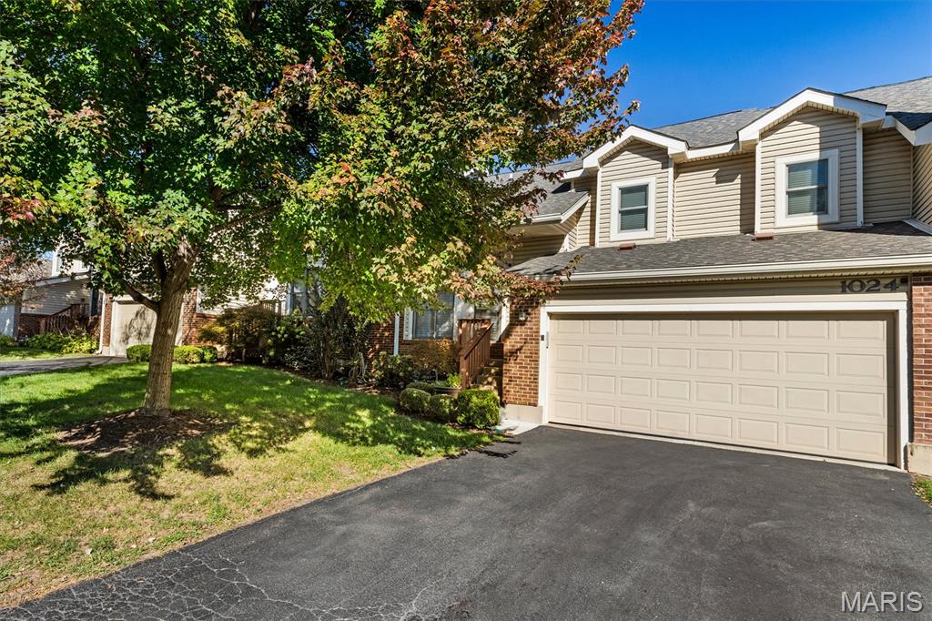 An exceptional opportunity for luxury living in Briarcliff! Thoughtfully renovated and beautifully appointed, this exceptional 3-bedroom, 3.5-bath Creve Coeur townhouse offers a level of craftsmanship and customization seldom found in condominium living, all within the highly regarded Ladue School District. Hardwood floors, crown molding, custom window treatments, and thoughtfully designed storage elevate the home throughout. At the heart of the home is a spectacular chef's kitchen, completely rebuilt from the studs and designed with an appreciation for both form and function. A stunning 10-foot island, Vermont marble countertops, custom Beck Allen cabinetry including a beautiful built-in glass-front storage cabinet, Wolf appliances, and induction cooking create a kitchen that is as beautiful as it is functional. The adjoining dining area opens through custom doors to a spacious composite deck, ideal for indoor-outdoor entertaining. The inviting living room features a custom Forshaw fireplace with marble surround and handsome Beck Allen built-ins.  A lovely main-floor powder room completes this level. Completely renovated in 2016, the upper level offers a gracious primary suite with custom-organized closets and a luxurious bath featuring marble countertops, double vanities, custom cabinetry, and a walk-in shower. Two additional bedrooms and a beautifully updated hall bath complete the second floor. The finished walkout lower level provides exceptional flexibility, with hardwood floors, custom bookshelves, a generous family room, a third full bath, and access to a private patio, making it equally suited for entertaining, relaxing, or accommodating overnight guests. Abundant storage includes an impressive cedar closet with custom organization and a spacious laundry room. An oversized attached two-car garage offers direct access to the condo, along with a generous rear extension providing exceptional additional storage. Enjoy the ease of condominium living with community amenities including a pool and clubhouse, along with extensive exterior and grounds maintenance. An extraordinary combination of quality, comfort, and understated luxury in one of Creve Coeur's most desirable communities.