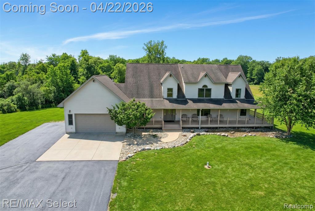 Set on over 33 private acres and tucked far from the road, this exceptional 4-bedroom, 3 full bath estate offers a rare blend of refined living and serene natural beauty.The main level showcases a thoughtfully designed open-concept layout with soaring ceilings, rich hardwood flooring, and an abundance of natural light. At the heart of the home, the gourmet kitchen features extensive custom cabinetry, stainless steel appliances, and a statement island with cooktop—ideal for both everyday living and elegant entertaining.The living room is a true showpiece, highlighted by a dramatic wall of windows framing picturesque views of the grounds and a stunning floor-to-ceiling stone fireplace that anchors the space with warmth and sophistication.The main-floor primary suite is a private retreat, complete with a spacious walk-in closet, direct access to a sprawling wraparound deck, and a spa-inspired ensuite featuring a deep soaking tub and separate glass-enclosed shower. An additional main-level bedroom offers flexibility for guests or a home office.Upstairs, two well-appointed bedrooms, a full bath, and a versatile bonus room provide ample space for family and guests.The expansive lower level offers a blank canvas to create an entertainment retreat, private fitness studio, or a space thoughtfully tailored to your lifestyle.Outdoors, the property transforms into a private resort, featuring a beautifully designed inground pool with slide, expansive deck for entertaining, and sweeping acreage that ensures complete privacy. A 2-car attached garage is complemented by a substantial pole barn, ideal for additional storage, hobbies, or recreational use.