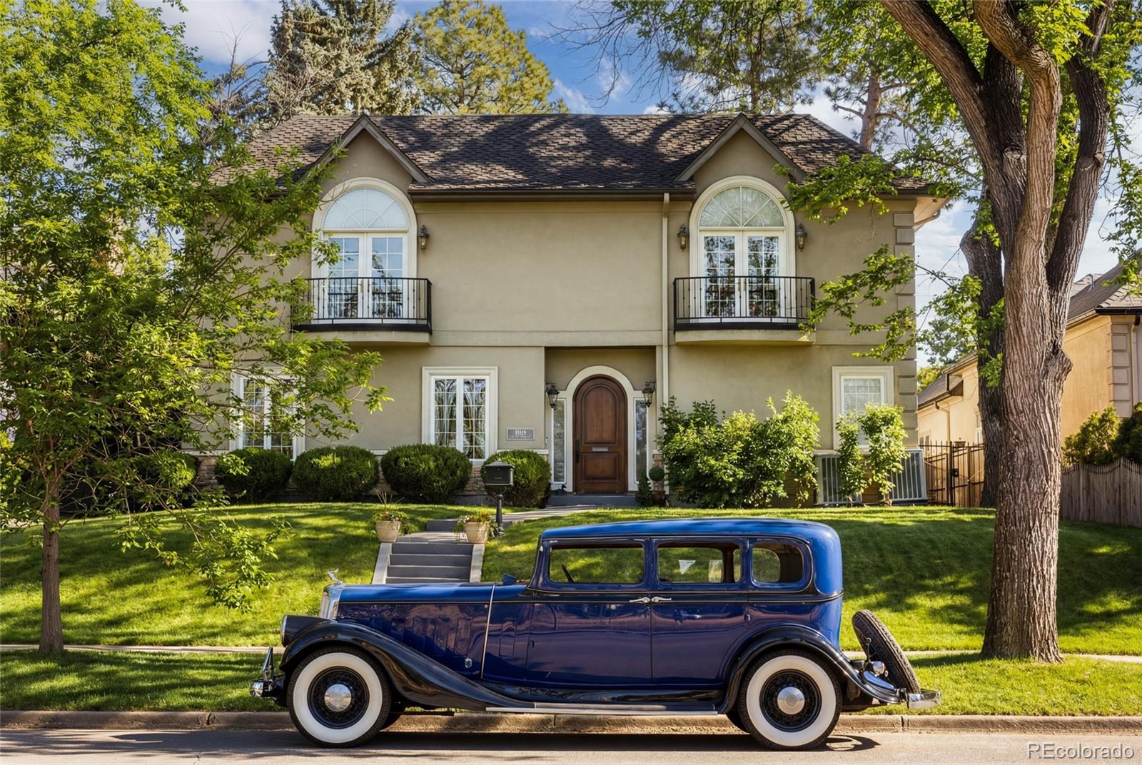 The Montclair Villa on Monaco is where timeless architecture and modern livability converge in one of Denver’s first suburbs. Set within Montclair, this distinguished residence reflects enduring craftsmanship, thoughtful scale, and a sense of permanence that transcends trends. Inside, the home unfolds with intention, offering five private en-suite bedrooms, including two primary suites, each designed as a true retreat with three of the bedrooms charmed with juliet balconies, a floorplan ideal for multigenerational living, hosting guests, or creating dedicated work-from-home or wellness spaces. Traditional living and dining rooms anchor the home with classic elegance, while updated systems and finishes provide the modern conveniences expected in today’s luxury lifestyle. Natural light, balanced proportions, and seamless transitions create spaces that feel both refined and welcoming; well-suited for quiet evenings or meaningful gatherings. You'll find your doors are open year-round to the fully fenced, tranquil backyard. The lower level expands the home’s versatility and entertainment appeal, featuring a generous recreation room, wine cellar, a dedicated home gym with steam shower, and a large theater designed for immersive movie nights, sports viewings, and relaxed entertaining. Every space is purposeful, offering flexibility without sacrificing character. The location is equally compelling. Cherry Creek’s premier shopping, dining, and culture are just 10 minutes away, as is Downtown Denver with its arts, sports, and energy. The Denver Tech Center is approximately 20 minutes away, while Denver International Airport is reachable in about 30 minutes - providing effortless connectivity while preserving neighborhood privacy. The Montclair Villa on Monaco is more than a residence. It is a home built for longevity, comfort, and connection—where traditional design, modern amenities, and an exceptional location come together to support a life well lived, for generations.