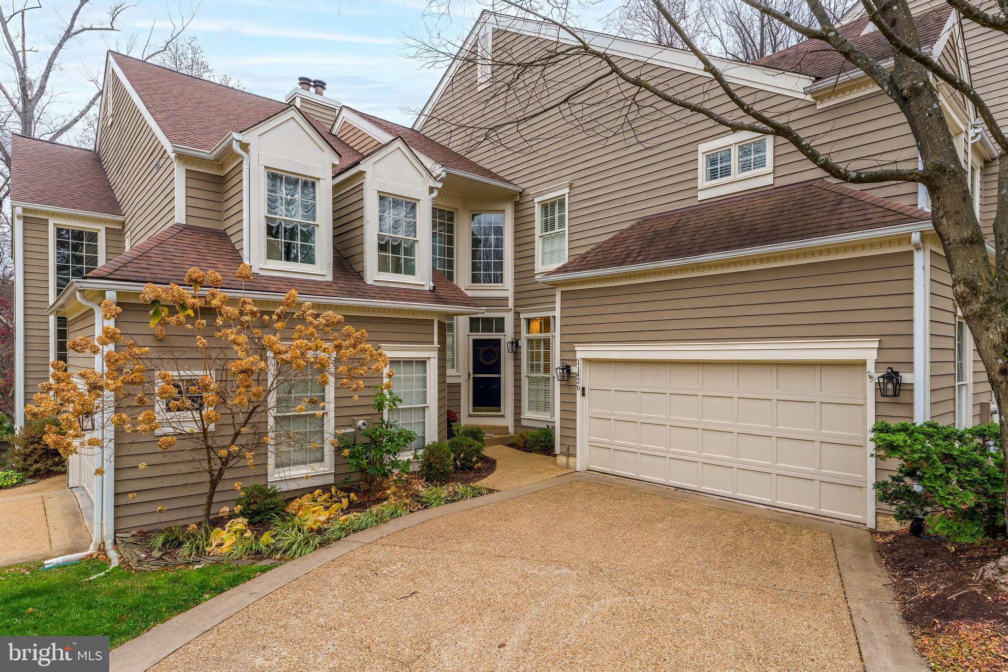 Join us on Friday, 2/20 from 4:30-6:30pm and Saturday, 2/21 from 2-4pm for an Open House.Welcome home to Hollow Timber Court — An exceptional patio-style townhouse in one of North Reston’s most coveted neighborhoods. This beautifully maintained and decorated 3-level home offers an attached 2 car garage with direct, interior access and a walk-out lower level with full-size, above grade windows. It's the perfect blend of space, comfort and convenience with peaceful wooded views from the deck and patio!The interior features elevated upgrades and tasteful designer finishes. Step inside to a dramatic 2-story foyer and living room featuring a stunning centerpiece fireplace and an impressive wall of windows that fill the home with natural light. The separate dining room and eat-in kitchen offer great flow for everyday living and easy entertaining.Upstairs, you’ll find two bedrooms, including a spacious primary suite with an updated en-suite bath, inviting you to a relaxing retreat at the end of the day. The lower level adds even more flexibility with a full bedroom and a rec area — perfect for guests, a home office, or additional living space.Enjoy all that Reston Association has to offer with access to walking paths, pools, tennis courts and more. Ideally located steps from North Point Village Shopping Center, you can easily walk to Starbucks, dining and the grocery store! Trader Joes, Reston Town Center, and Whole Foods are all a quick drive away. Commuting to Arlington or DC? You're minutes from Silver line Metro access at Reston Town Center and Wiehle Ave and ten minutes to Dulles International Airport. Zoned to Aldrin Elementary School. Welcome home!