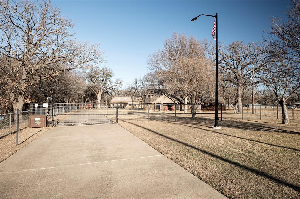 This one of a kind property includes exceptional versatility for business use, entertaining, or multi generational living on 5.029 private acres. Surrounded by natural beauty, it provides a combination of privacy, functionality, & abundant amenities.The main residence is a ranch style 2-story home with 5-bedrooms, 3-full bathrooms, 2-half baths, with an attached epoxy coated 2-car garage.Spacious living areas include an enclosed sunroom, a second floor bonus room, a home office, 2-dining areas, and an eat-in-kitchen with solid wood cabinetry and a spacious utility room.The first floor primary suite has a sitting area with bay window and an ensuite bath with a separate shower and garden tub.Designed for entertaining, the backyard is an outdoor oasis with a large diving pool, a covered 8-person hot tub, & covered patio featuring an outdoor kitchen and entertaining space. A fire pit area has a unique grain silo roof adding to the property’s character.A separate workshop includes a 1,000 square foot guest residence with a full kitchen, 2-bedrooms, an office, and 2-full bathrooms, ideal for extended family, guests, or income potential. The workshop is fully equipped with 220V service, welding plugs, and a 12-foot roll up door. Additional features include a pole barn style 3-car parking shed, a barn and grazing area, RV parking with hook up, and extensive cross fencing.The grounds are accented by a trumpet vine covered patio and a creek with a bridge that feeds into a half acre, 14 foot deep pond. Primary residence upgrades include granite countertops, plantation shutters, 3-HVAC units, and a new roof installed in 2023. This exceptional property offers abundant space, endless possibilities, and is truly a rare find. *Note – Seller to Retain Mineral Rights. Property survey available. Buyer and Buyer's Agent to verify all information related to but not limited to schools, property dimensions, boundaries, easements, restrictions, room measurements and square footage.