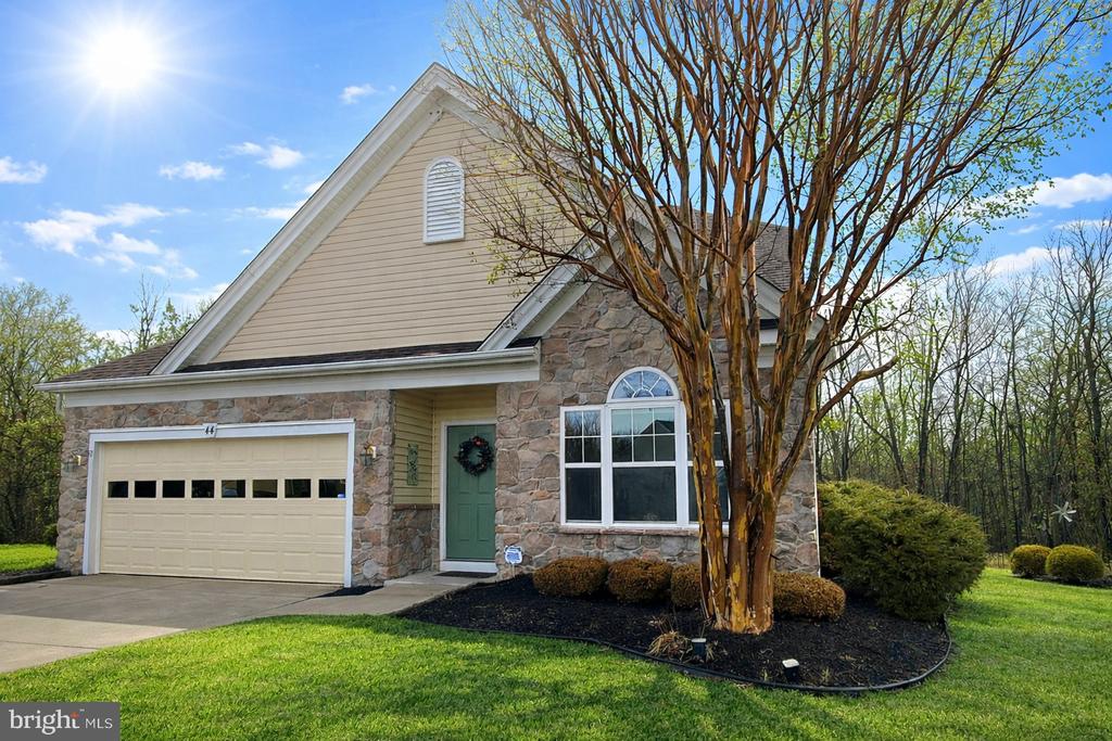 *****PREMIERING - March 8th at NOON*****  (PHOTO SHOOT IN PRODUCTION)Located In The Highly Sought-After LEGACY OAKS AT EVESHAM, This Attractive Fitzgerald Grand Model Offers 2,656 Square Feet Of Spacious Living On One Of The Community’s Premier Very Large Cul-de-Sac Homesites. Set On The 6th Largest Lot In Legacy Oaks (.216 Acres), The Professionally Landscaped Property Backs To A Private Wooded Area And Features An Expanded Deck And Bright Sunroom, Creating An Exceptional Indoor-Outdoor Living Experience.  Curb Appeal Is Enhanced By A Stone Front Elevation, Full Two-Car Driveway Flanked By PAVERS, And a Welcoming Covered Entry.  Inside, This 3-Bedroom, 3 Full-Bath Home Showcases A Dramatic Entry Foyer With Vaulted Ceiling And Views To The Large Loft Above, Along With Formal Living And Dining Rooms Ideal For Entertaining.  The Spacious Kitchen And Breakfast Room Feature Upgraded Yorktowne 42" Cabinetry, Granite Countertops, An Enlarged Center Island, Tiled Backsplash, Stainless Range And Microwave (2016), Stainless Dishwasher And A Brand New Refrigerator (2025).   Hardwood Flooring Extends From The Foyer Into The Kitchen And Large, Bright Breakfast Room.   Major Mechanical Updates Include A LENNOX HVAC System (2021) And A Navien Tankless Hot Water Heater.   Also a BRAND NEW ARCHITECTURAL DIMENSIONAL ROOF (2023).  The Expansive Family Room Is Filled With Natural Light And Offers A Soaring Vaulted Ceiling, Numerous Windows, And Direct Access To The Sunroom And Enlarged Deck, All Overlooking A Peaceful, Wooded Backyard. Additional Highlights Include 9-Foot Ceilings, Soaring Ceilings, Numerous RECESSED LIGHTS, Energy-Efficient Vinyl Insulated Windows, And An Underground Multiple Zone Lawn Sprinkler System. The Main-Level Owner’s Suite Features Tranquil Wooded Views, A Triple Window, Two Closets Including A Large Walk-In with a CUSTOM SHELVING System, And A Completely Remodeled Primary Bath with Tuscany Carrera Marble Counters, Large Upgraded Tiled Shower with Custom Shower Door, Upgraded Flooring and More.  Also On The Main Level Are Guest Bedroom #2 Or Office, Full Guest Bath, A Separate Laundry Room With Newer Washer And Dryer (2022), CENTRAL VACUUM SYSTEM And Interior Access To The Two-Car Garage With Automatic Opener.   The Upper Level Offers A Large Loft Overlooking The Family Room, Bedroom #3, A Third Full Bath, And A Very Large Storage Room With Attic Access.  NOTE 1: CUSTOM FEATURES & UPGRADES LIST, SELLERS DISCLOSURE AND FLOOR PLANS ARE IN THE DOCUMENTS SECTION.NOTE 2: Listing Agents, Have Lived In LEGACY OAKS For Many Years, And Are Happy To Conduct A Personal Tour Of The Very Luxurious, Recently Renovated LEGACY OAKS CLUBHOUSE AND AMENITIES. This Personal Clubhouse And Amenities Tour Is Typically A Deciding Factor In The Purchase Decision.