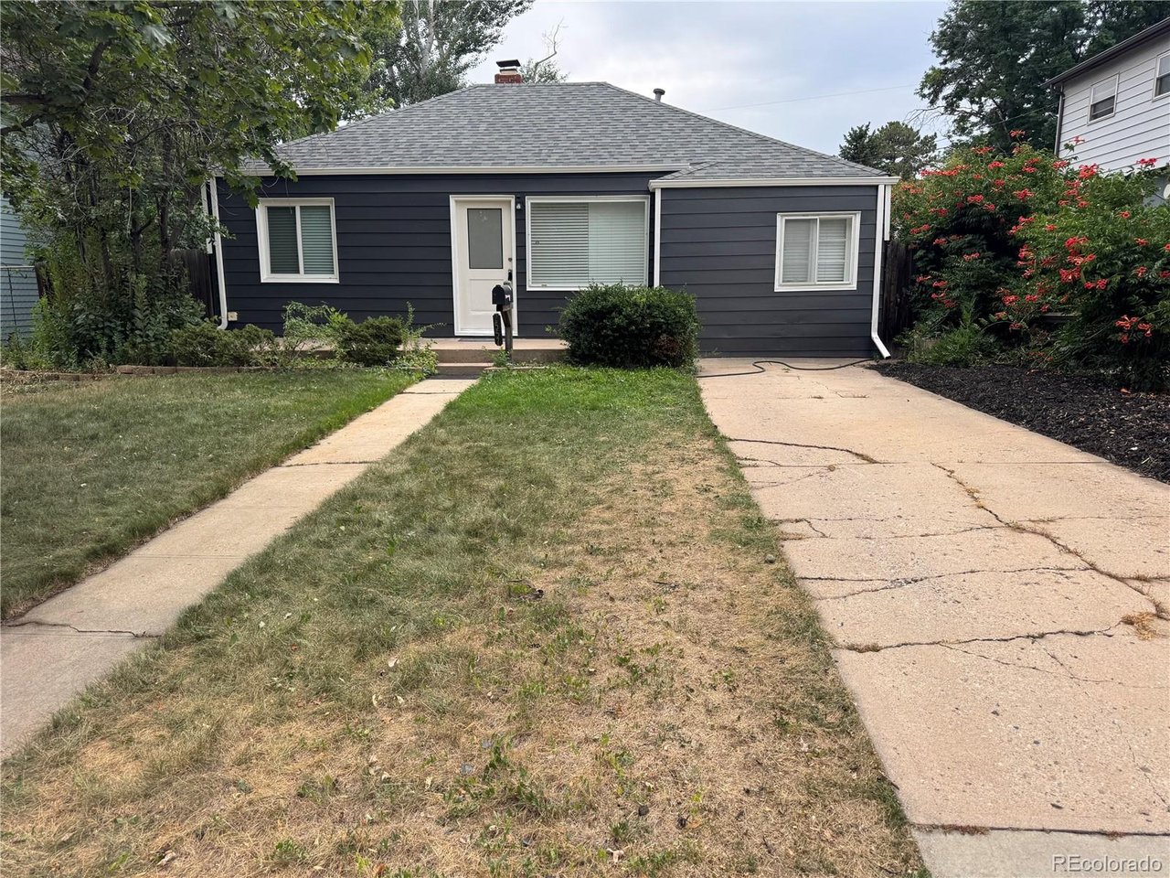 Come check out this charming 2 bedroom 2 bath home in Edgewater! Original hardwood floors have been sanded down and refinished. Open floor plan with new cabinets and quartz countertops. The primary suite has a large walk-in closet and a 3/4 bathroom with a double sink vanity and walk-in shower. The mudroom has a utility sink and stackable washer and dryer. Large backyard is fully fenced. 1 car detached garage with an extra storage room area. Just a few blocks from Edgewater Beer Garden and Sloan's Lake! Make this wonderful home yours today.
