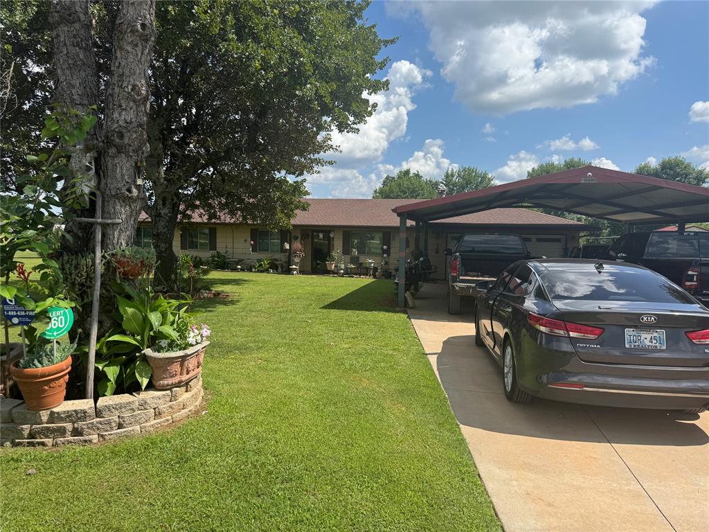 Beautiful new kitchen, granite counter top, sleek new flooring throughout. Added a new concrete driveway with  a large carport big enough to give shelter to 4 trucks. 3 beds, and a study with 2 living rooms. Outbuildings and horse stalls with pastures fenced. Chicken coups, barns in a pristine country setting.