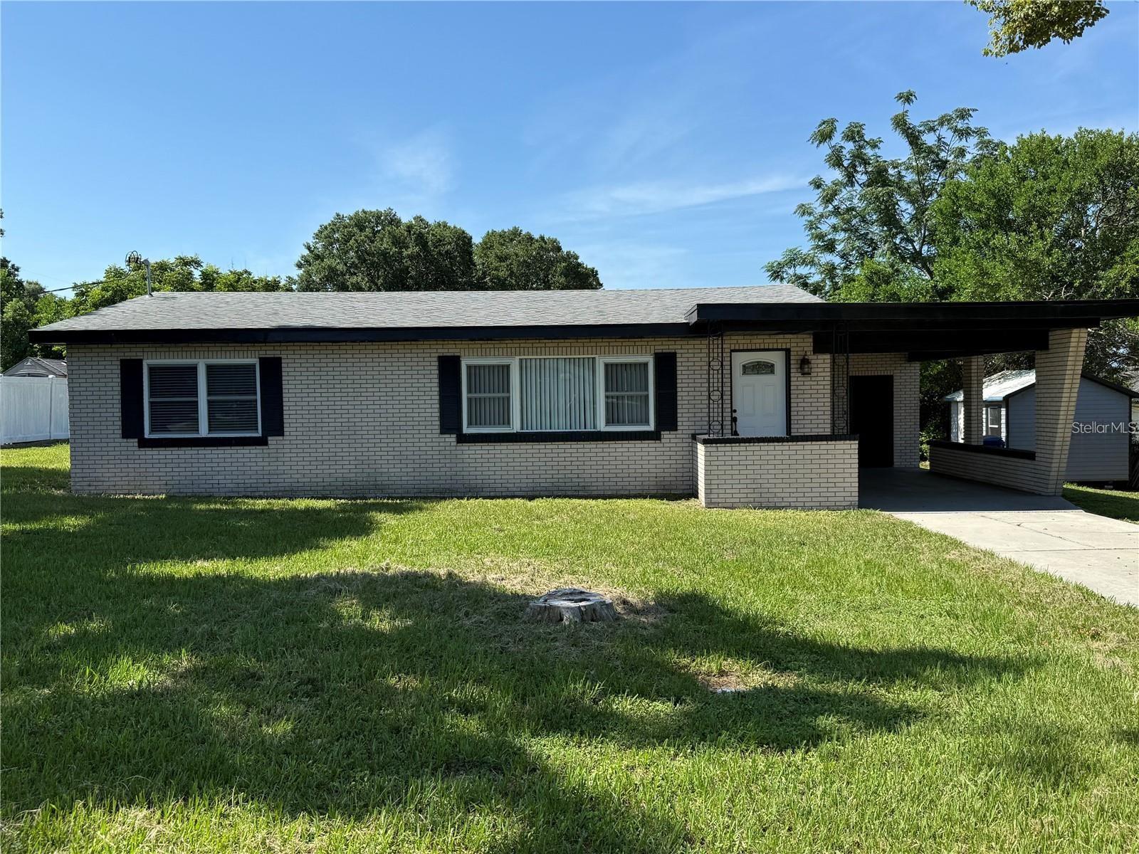 Welcome Home! This updated 2-bedroom, 1-bath brick home is perfect for a first-time buyer! Sitting on almost a quarter-acre in a non-flood zone, this home offers peace of mind and plenty of outdoor space to enjoy. Inside, you’ll find fresh updates throughout, including new flooring, an updated bathroom, and a bright kitchen with modern touches. The open layout makes the home feel spacious and comfortable, while large windows bring in plenty of natural light. The property includes a covered carport, a newly installed drain field (2024) for the septic system, and a spacious backyard—great for pets, play, or future plans like a garden or shed. Located on a quiet street with easy access to shopping, schools, and parks. This move-in-ready home is a fantastic opportunity for buyers looking for a solid home with updates already done. Schedule your tour today—homes like this don’t last long!