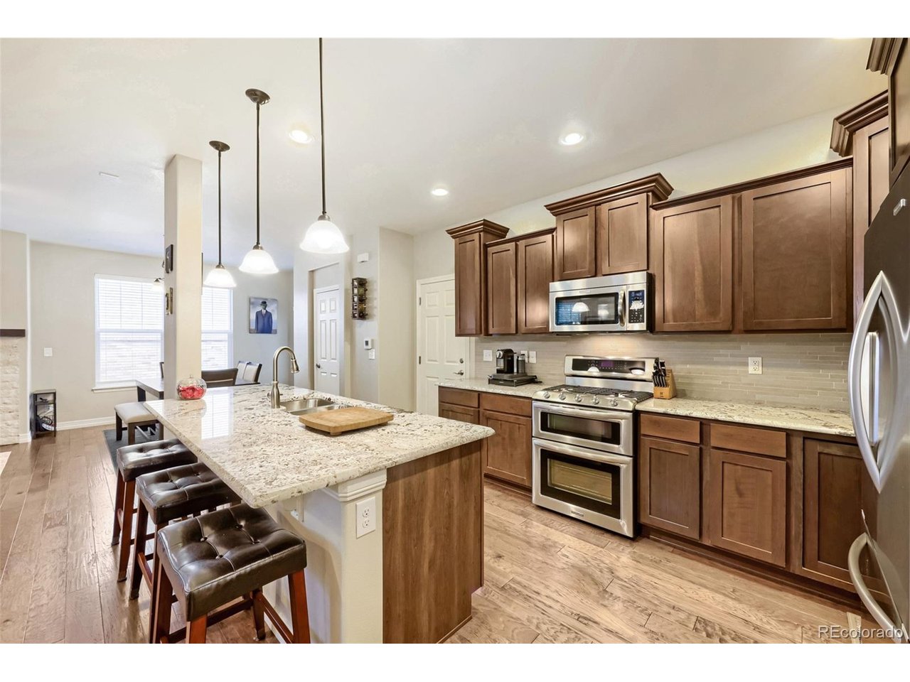 This Westminster home is not only beautiful, it is ideally located, with the neighborhood park, Big Dry Creek Trail, and Westminster Sport Center only a hop-skip away, and just 6 minutes to The Greg Mastriona Golf Course, Westminster City Park Rec Center and Westminster Promenade with its coffee shops, movie theater, ice skating, shopping, and restaurants. A 10-minute drive to Westminster Hills Off-Leash Open Space and Standley Lake makes this the perfect home for those wanting a little adventure without traveling far from home!When you arrive, you'll notice a lovely tree-lined courtyard leading to a welcoming front porch. Inside, you'll find a beautiful kitchen with granite countertops and KitchenAid appliances, an open-concept layout, and access to your private stamped concrete patio and new turf yard through the dining room. A main-floor 1/2 bath makes this a great space for entertaining!  Upstairs, you'll find a loft/flex area perfect for a home office, homework, or crafting space, 3 bedrooms, including the primary bedroom with a fully renovated en-suite 5-piece bath featuring a soaking tub, beautiful custom tile shower, dual sinks, and walk-in closet. The spacious main bath serving the other two bedrooms offers dual sinks and plenty of counter space. A large upper-level laundry room rounds out the upstairs-never carry laundry up the stairs again!  In the basement, finished in 2017, you'll find a family room, another full bath, a fully conforming 4th bedroom, and a designated storage area. This home also features a new gas water heater, solar attic fan, radon mitigation system, and has been well cared for.NOTE:  Square footage has been verified against the original builder plans for this model and reflects the builder's documented measurements. Buyer is encouraged to do their own square footage measurements for verification.